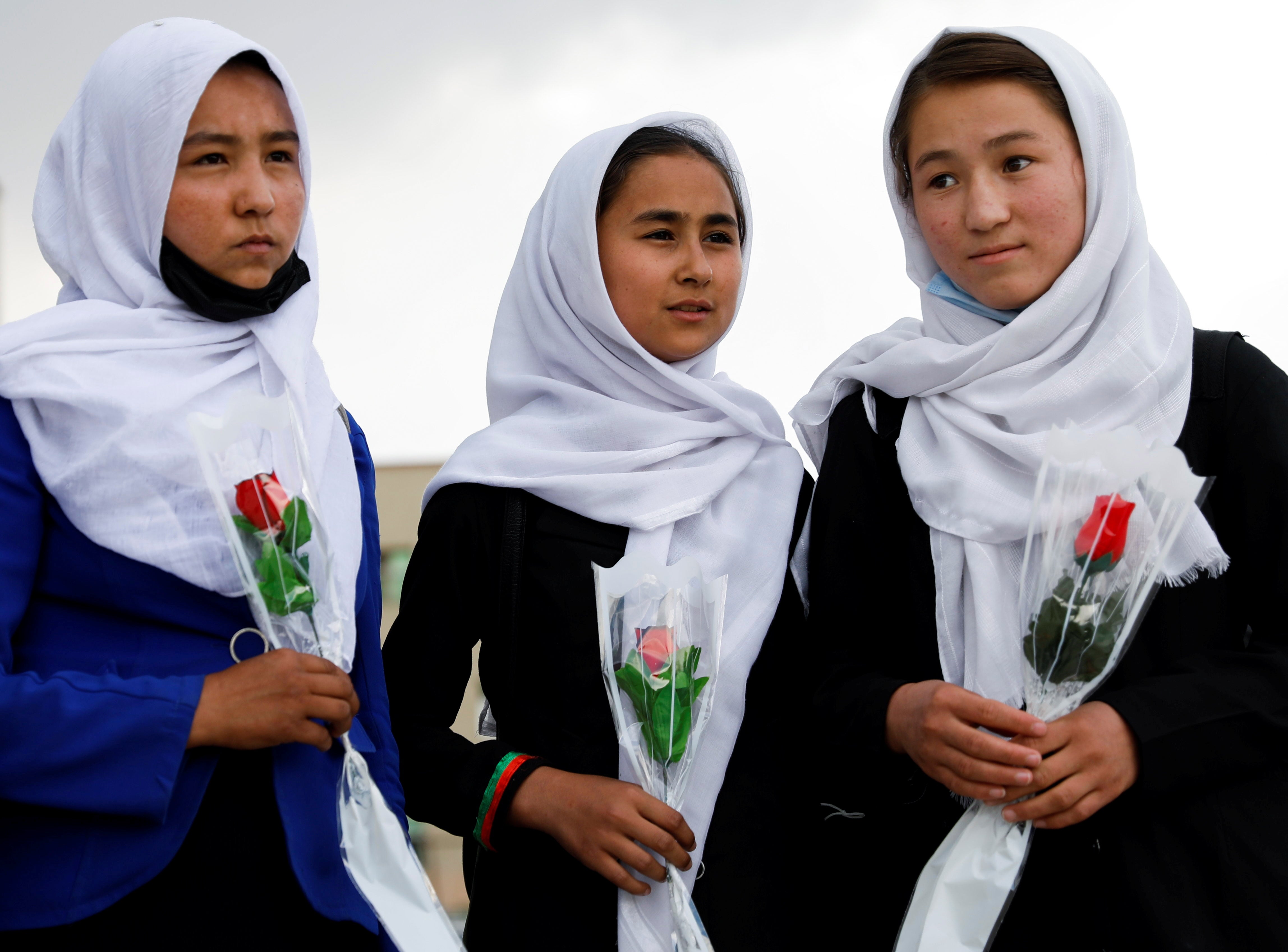 Schoolgirls arrive at a hospital in Kabul to visit students who were injured in a car bomb blast on Saturday