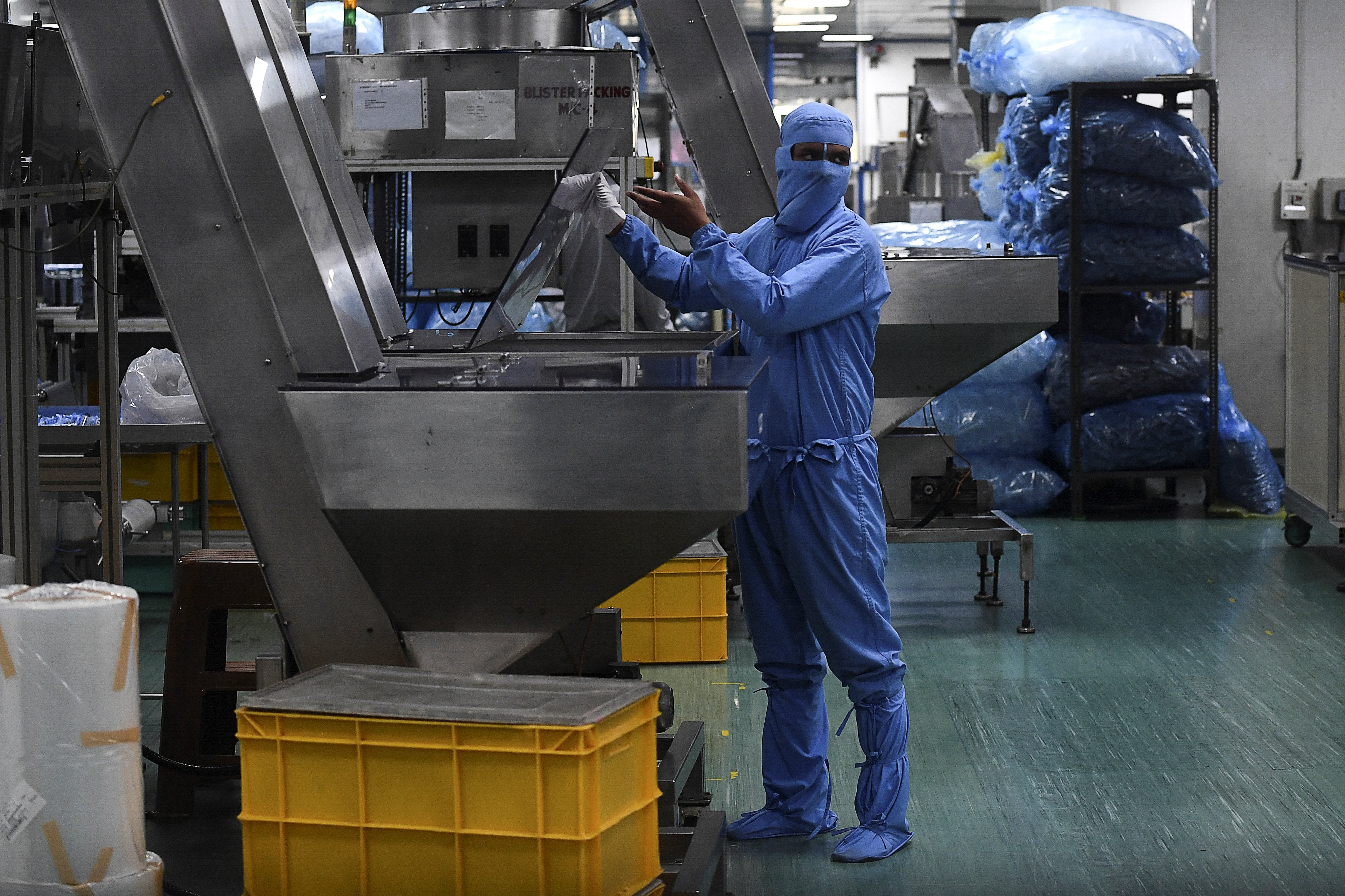 A worker checks a machine at the Hindustan Syringes factory in Faridabad on 2 September, 2020.