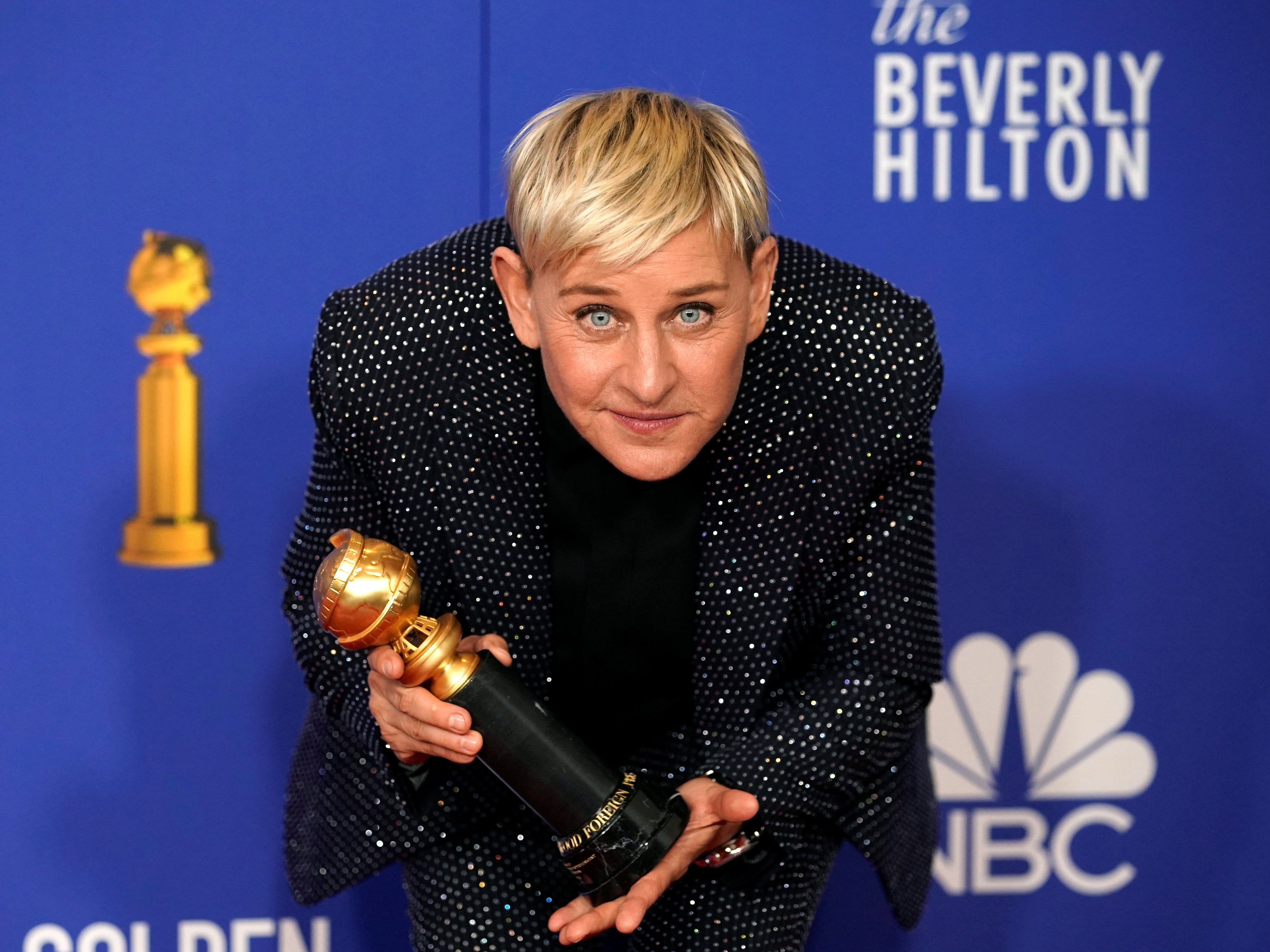 DeGeneres posing with her Carol Burnett Golden Globe award in January 2020