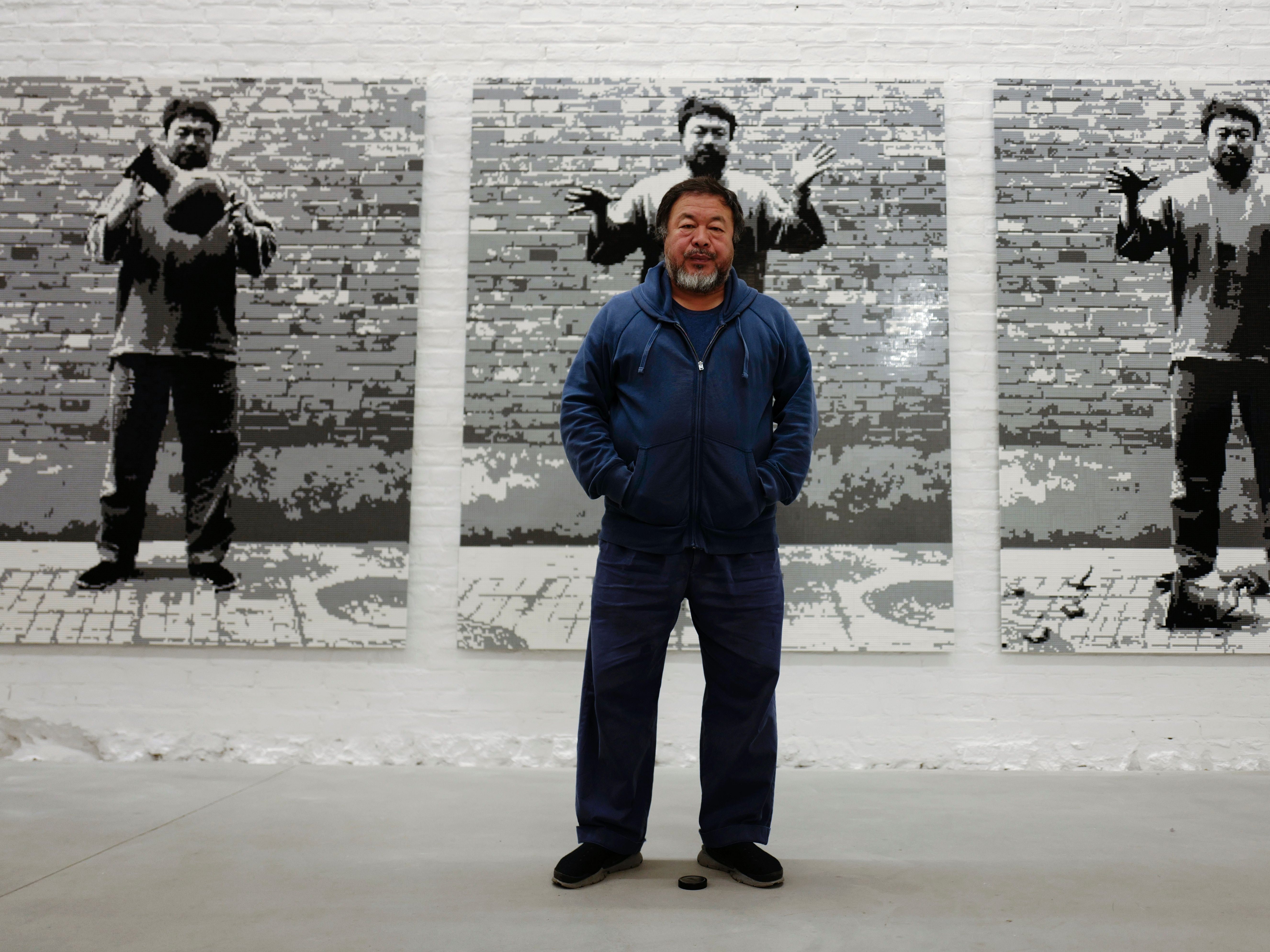 Ai Weiwei in front of his work, Dropping a Han Dynasty Urn, 2016, at his studio in Berlin