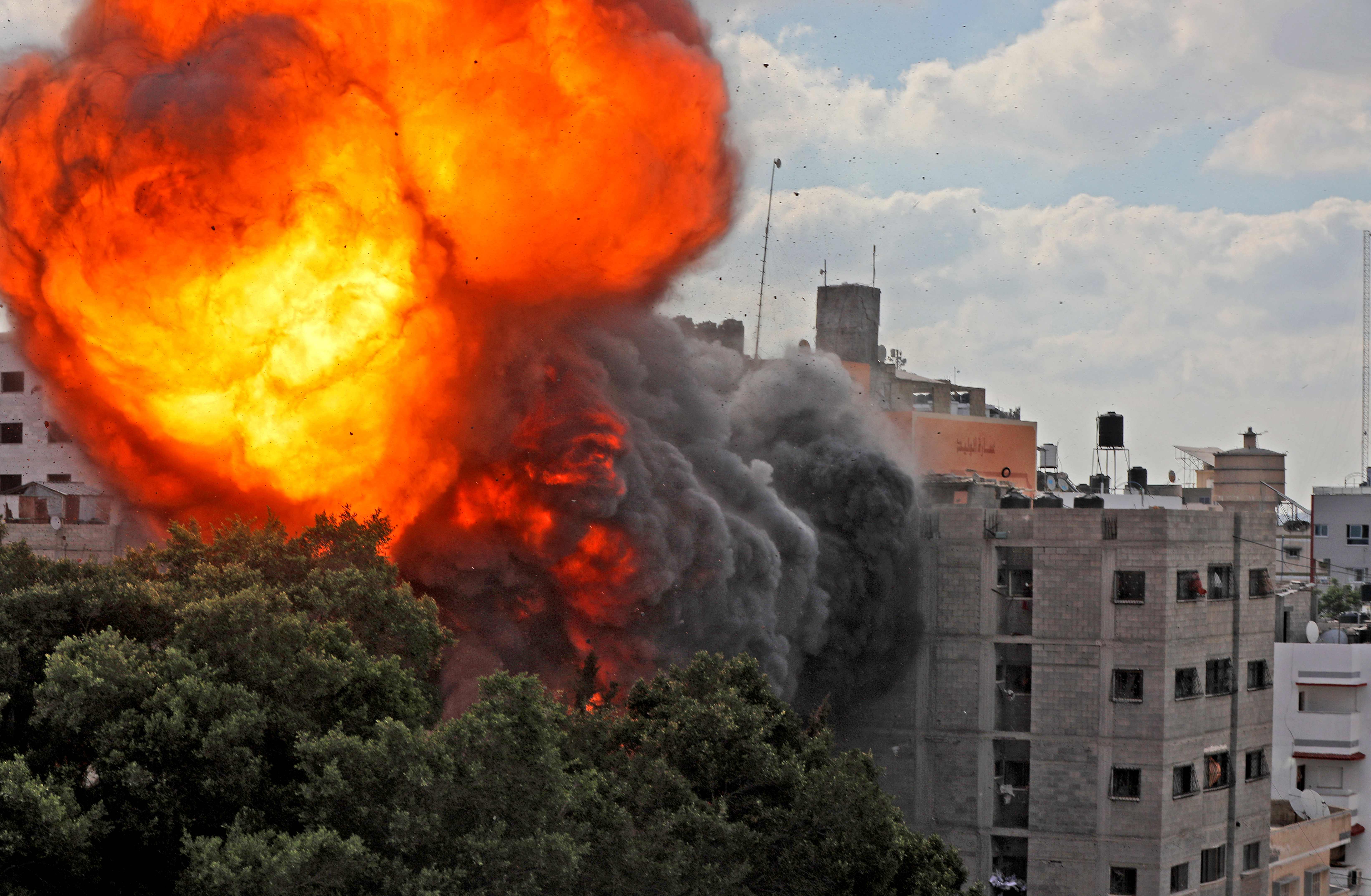 A fire ball engulfs the Al-Walid building in Gaza City