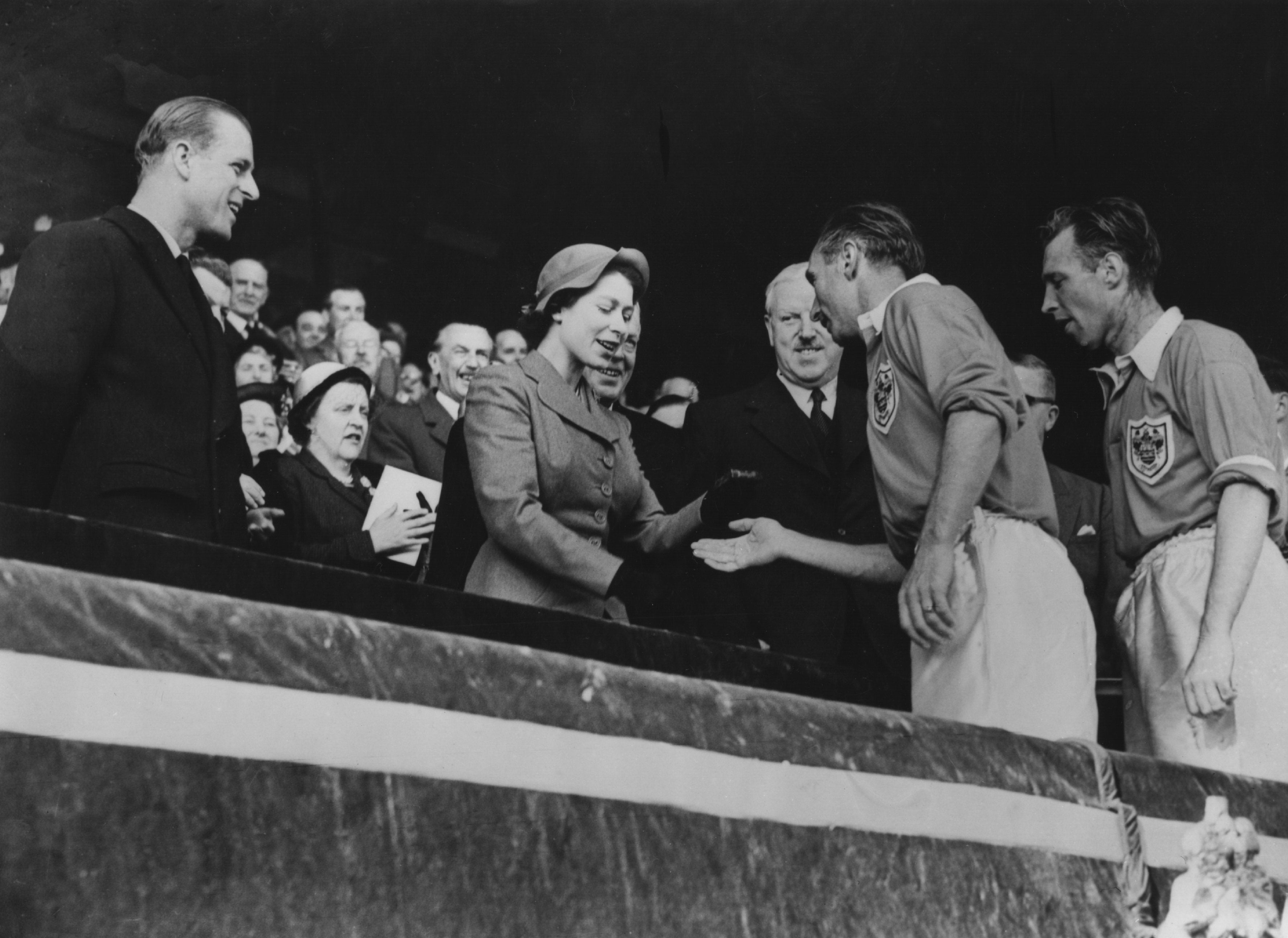 Blackpool’s Stanley Matthews receives his medal from the Queen