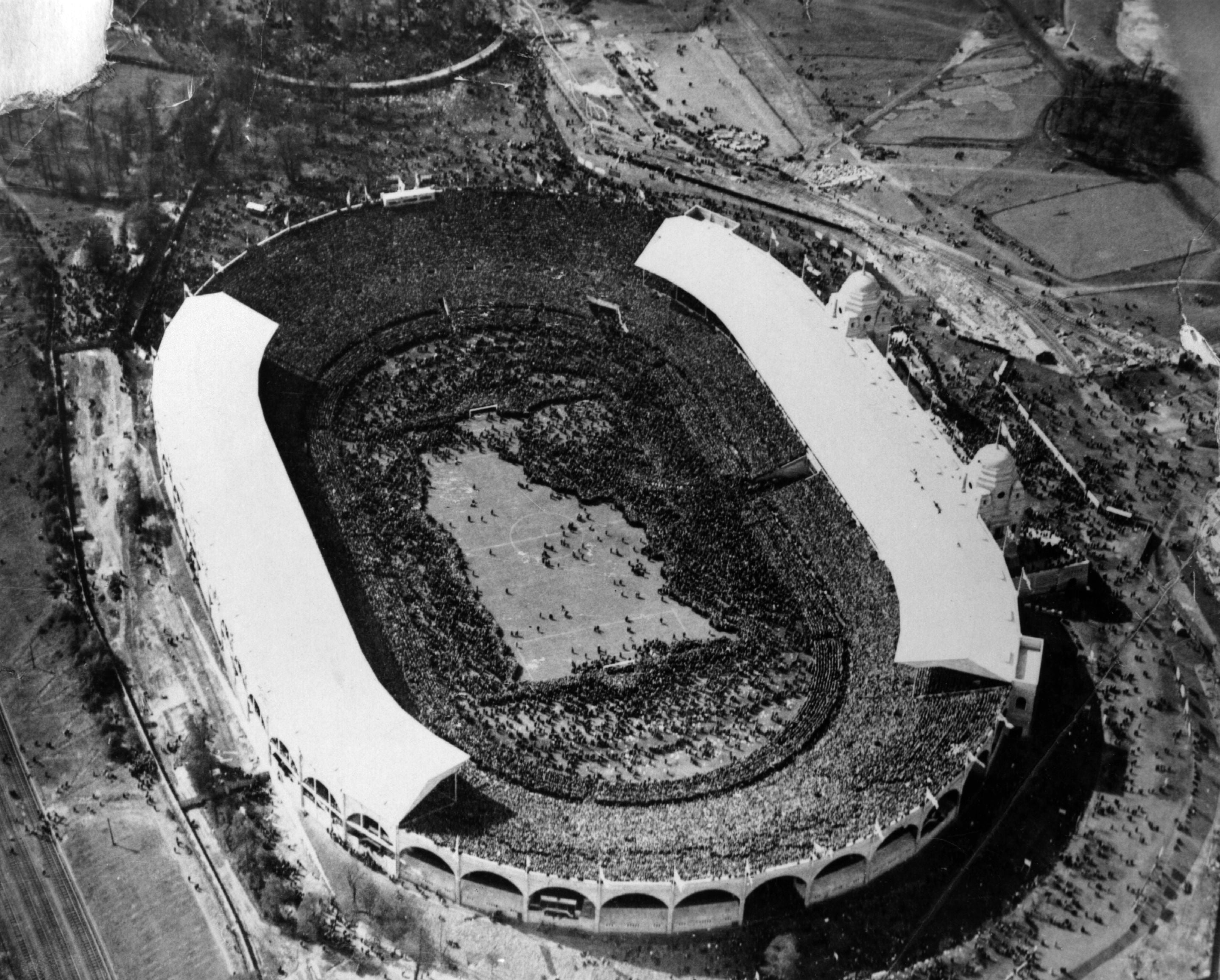 The first Wembley final in 1923. West Ham beat Bolton 2-0 before a pitch invasion