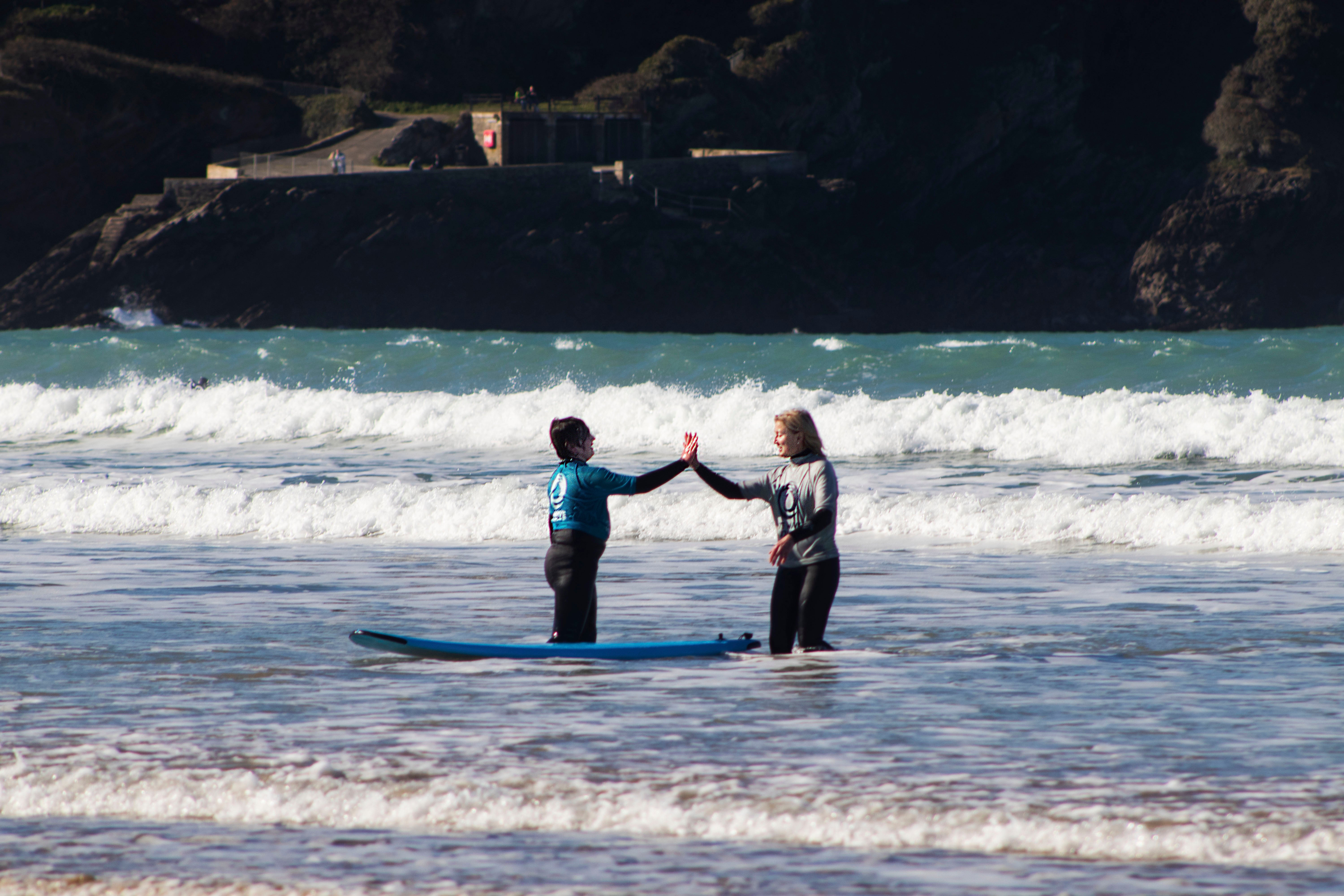 The physical danger in surfing helps students bond with their mentors