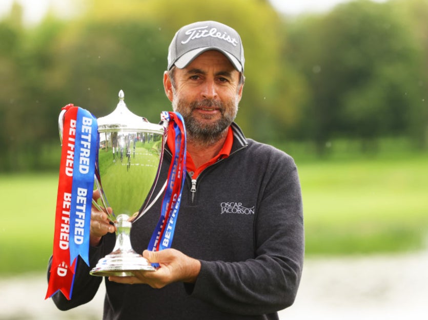 Richard Bland poses with the trophy