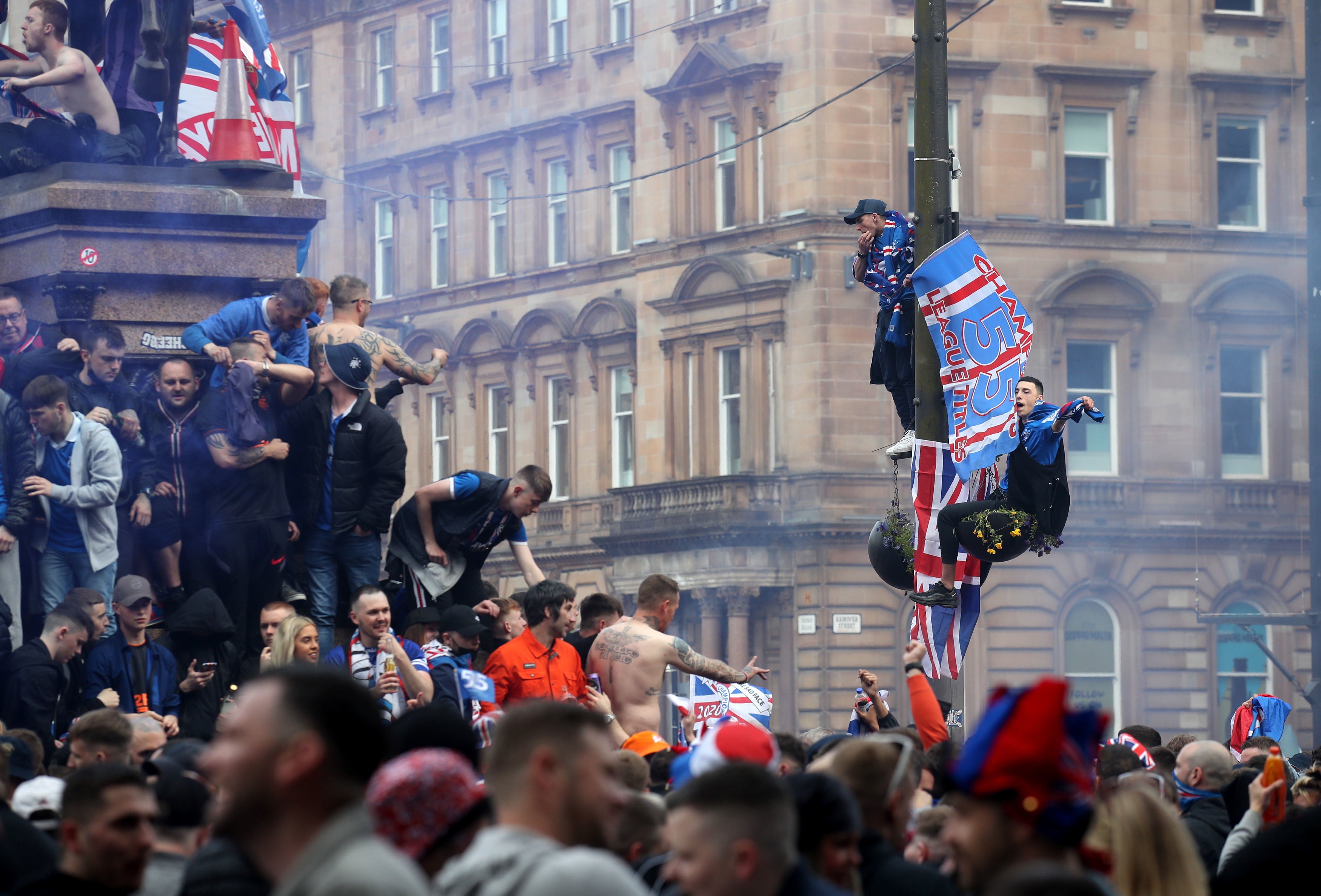 Rangers fans celebrate in George Square, Glasgow, despite the city still being in Scotland’s level 3 of lockdown