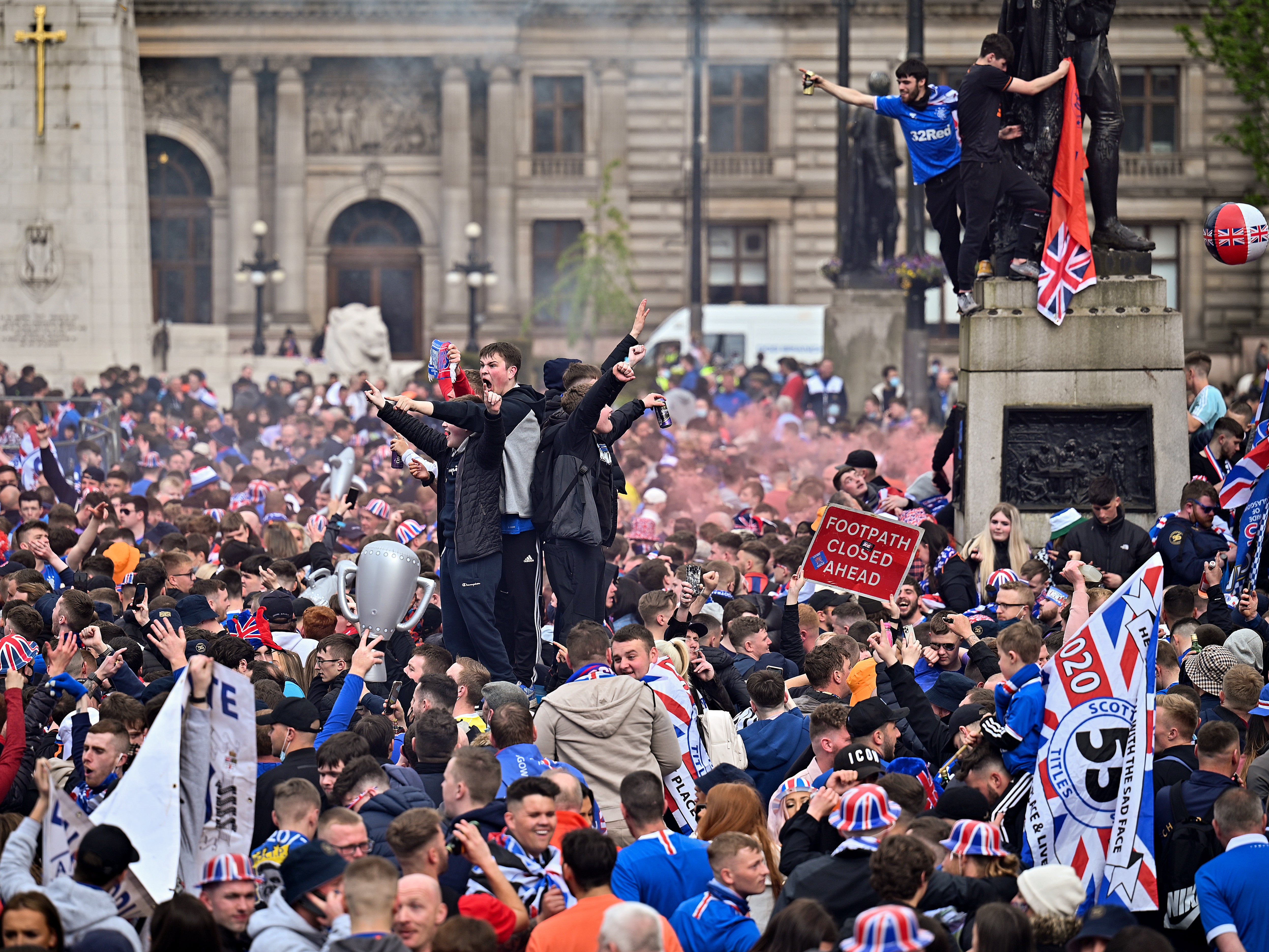 Thousands of fans gather in central Glasgow, many of who do not appear to be wearing face masks