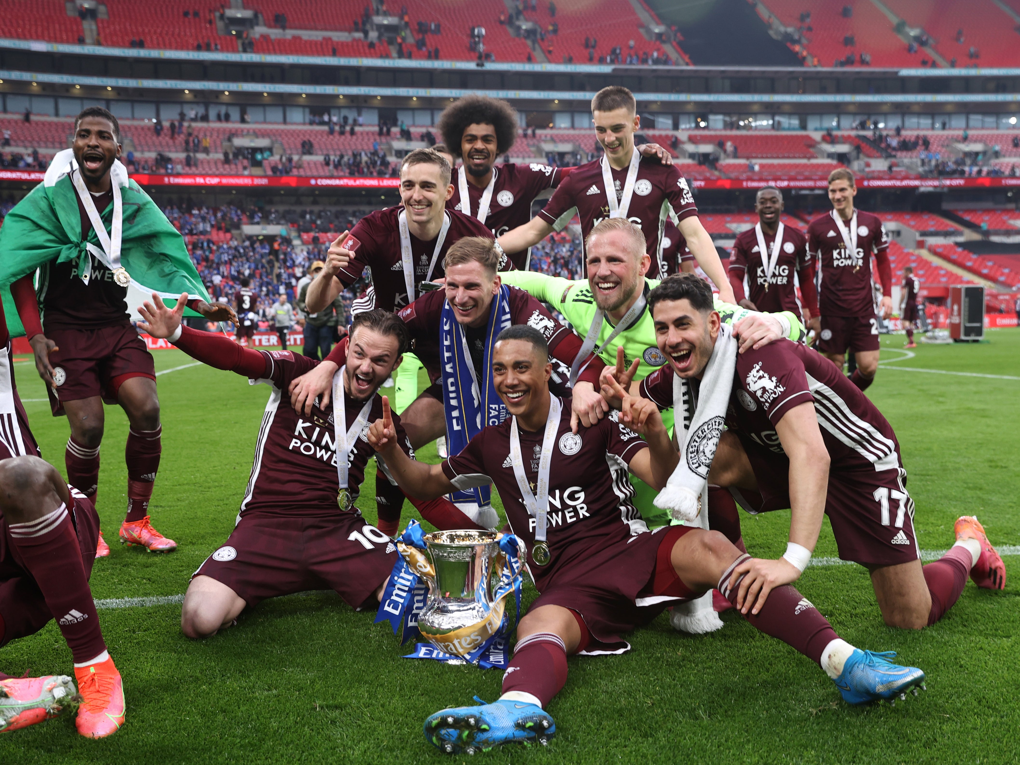 Match-winner Youri Tielemans, front centre, celebrates with team mates