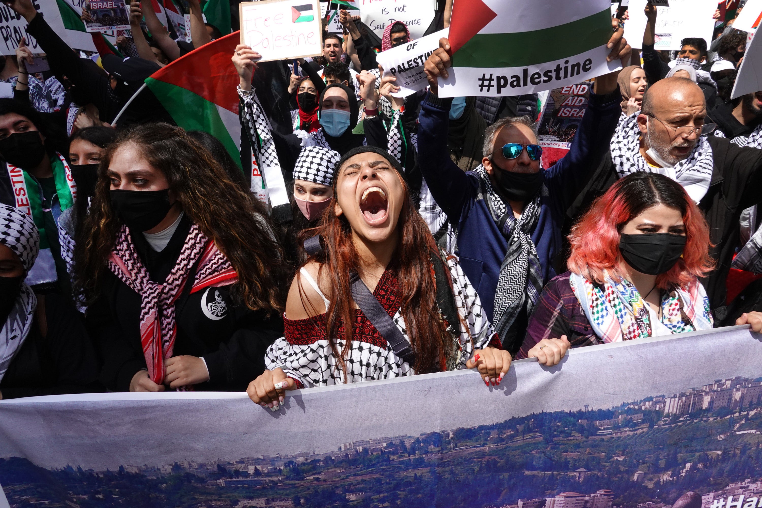 People march through downtown protesting Israeli airstrikes in the Gaza Strip on May 16, 2021 in Chicago, Illinois.