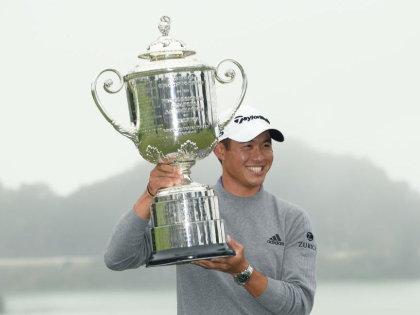 Collin Morikawa celebrates with the Wanamaker Trophy