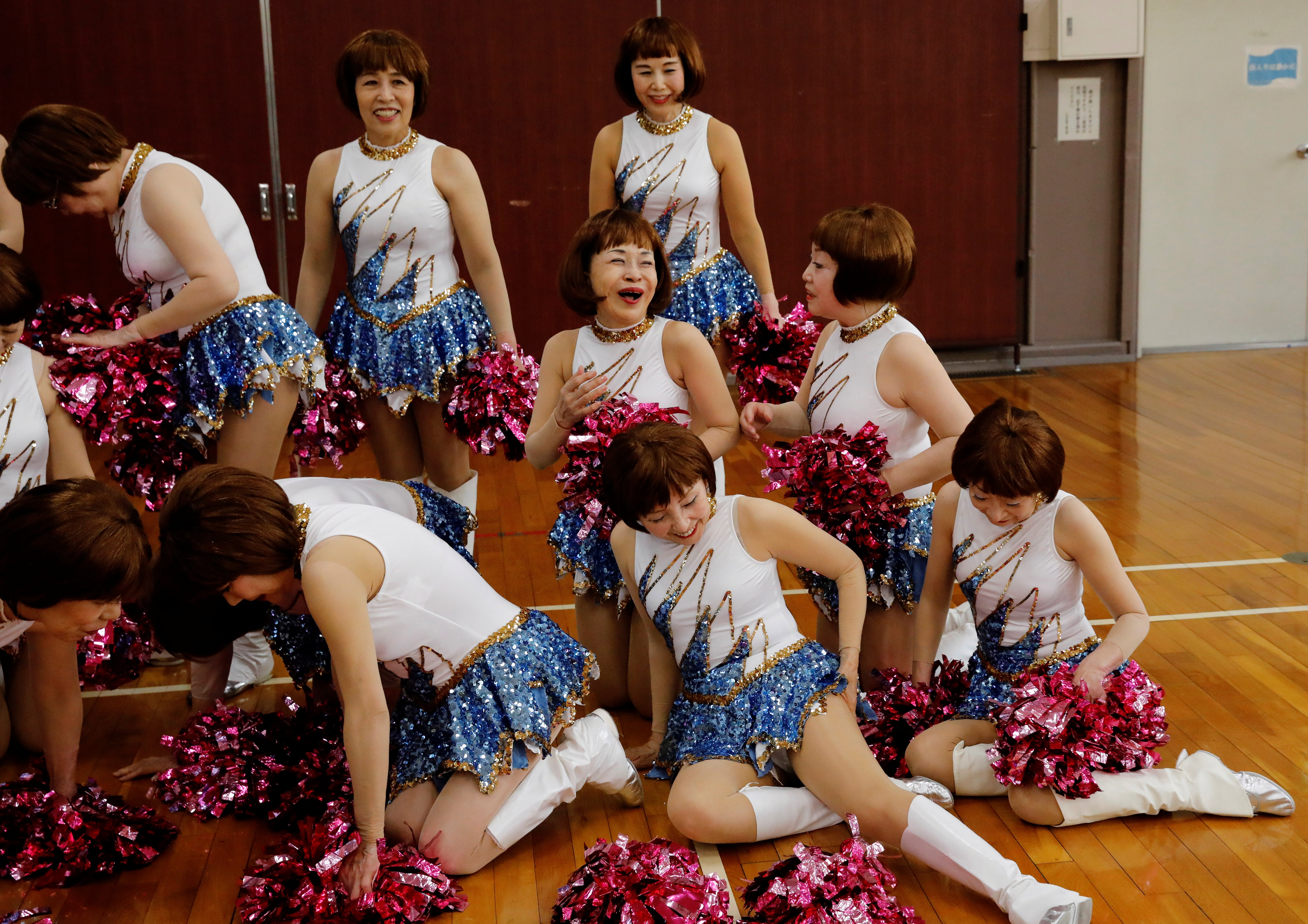 Members share a joke after posing for commemorative photos