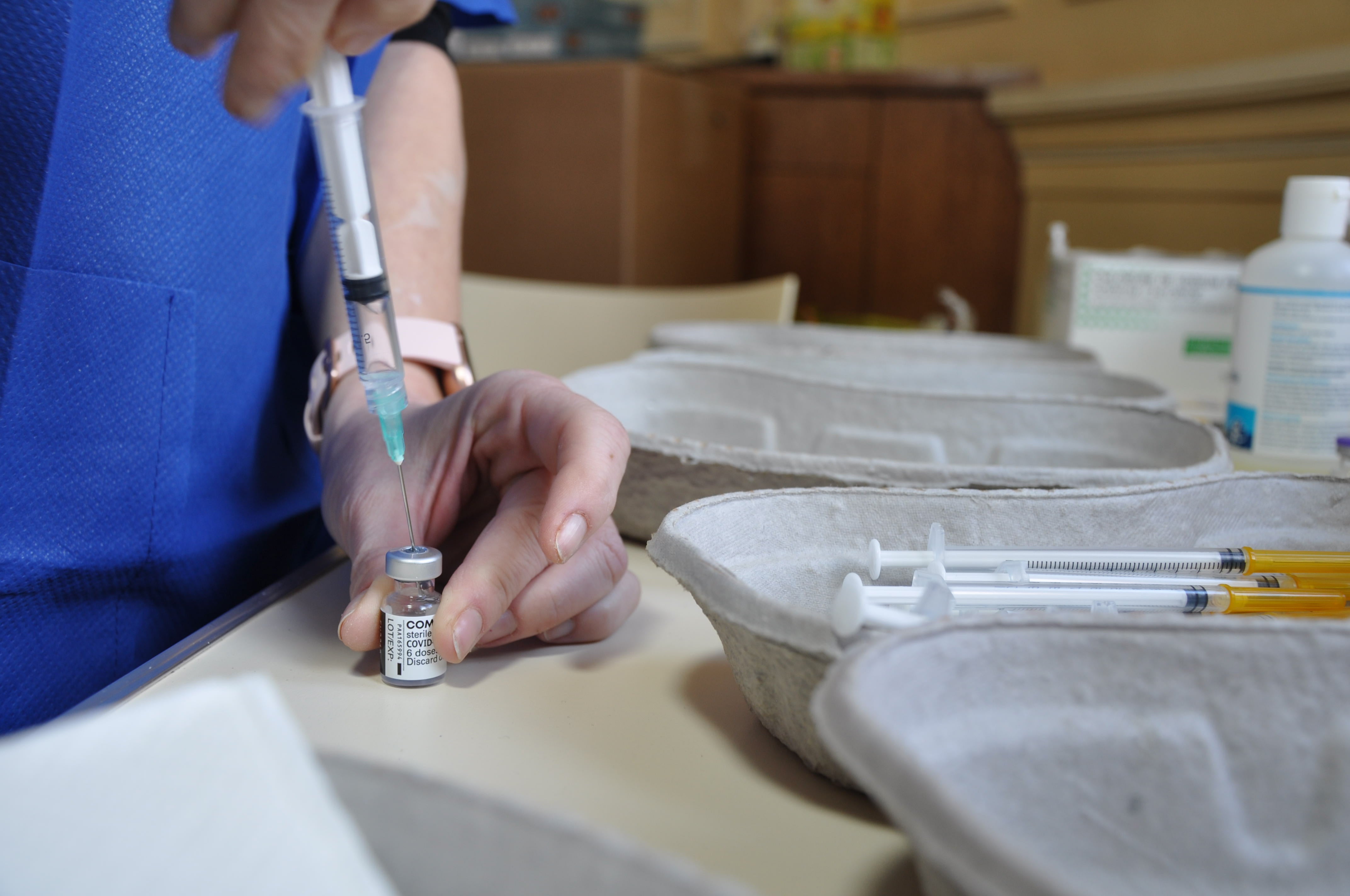 A nurse prepares a syringe with the Pfizer vaccine. No one in France wants AstraZeneca