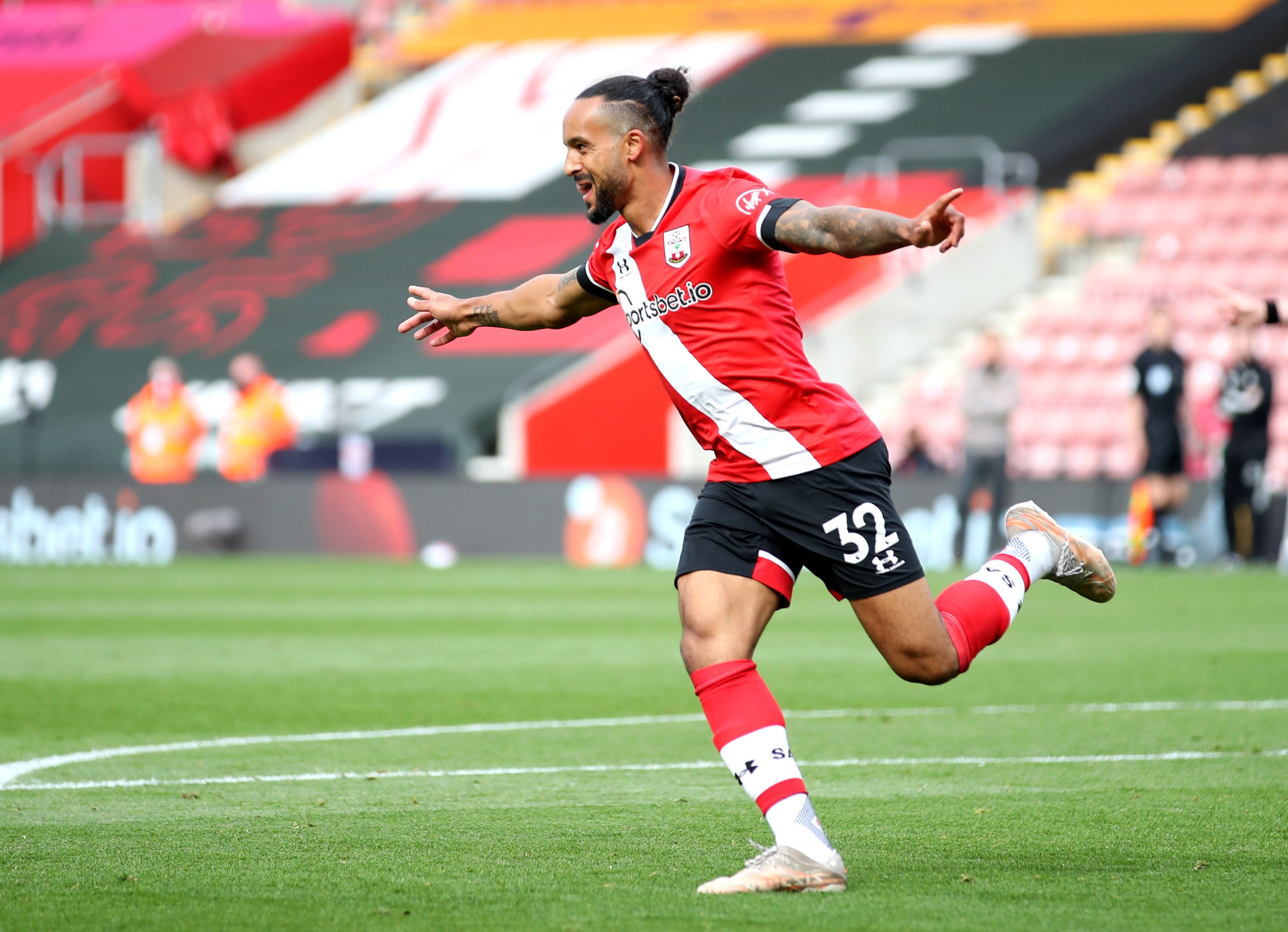 Theo Walcott celebrates after scoring for Saints