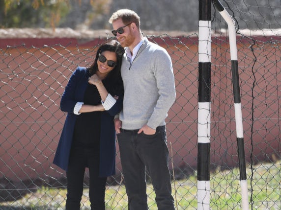 Meghan, Duchess of Sussex and Prince Harry, Duke of Sussex watch students play football during their visit to Lycée Qualifiant Grand Atlas, the local secondary school in February 2019 in Asni