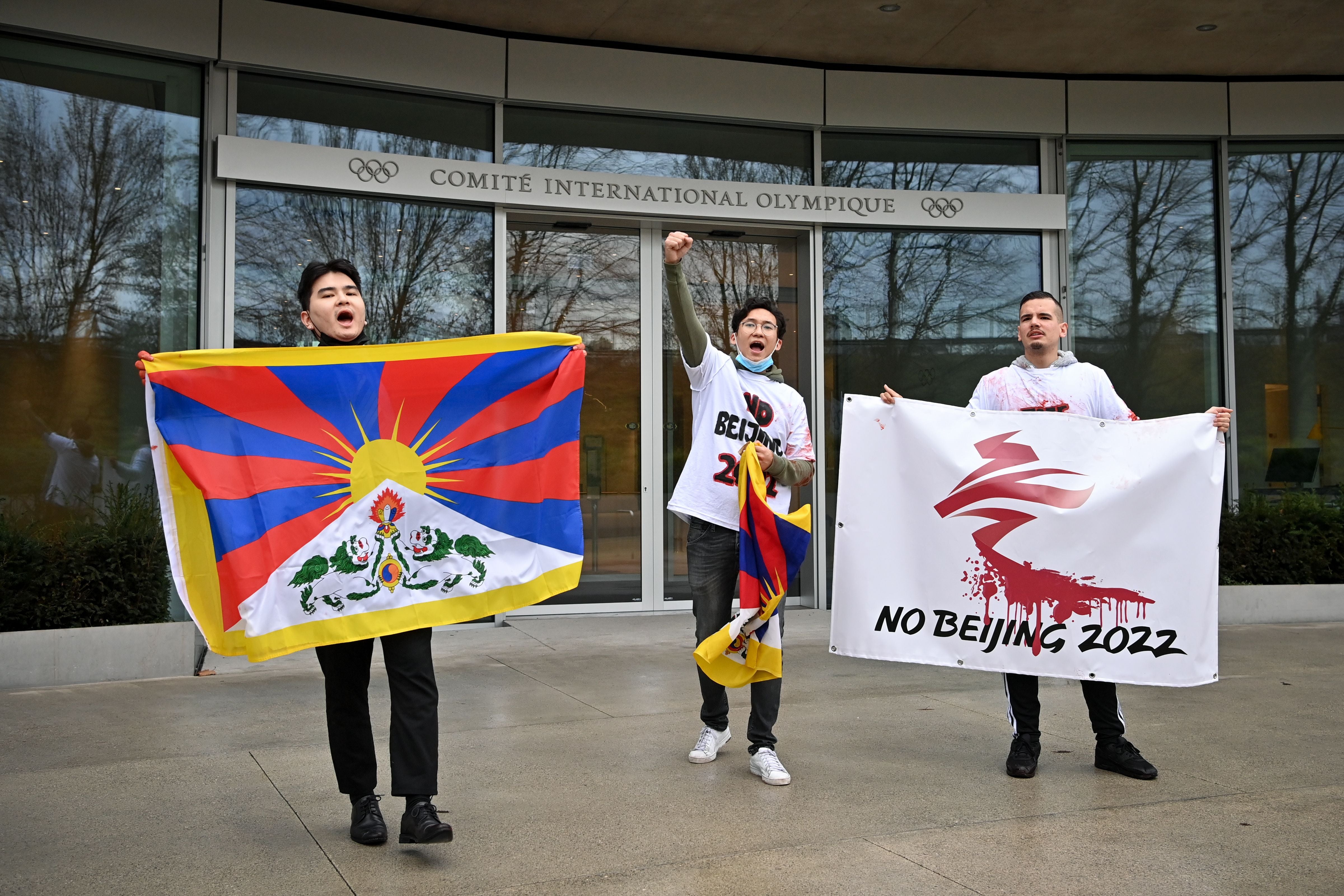 Activists of the International Tibet Network holds Tibet's flags in front of the IOC headquarters during a protest against Beijing 2022 Winter Olympics on February 3, 2021 in Lausanne. A coalition of campaign groups issued an open letter calling on world leaders to boycott the Beijing 2022 Winter Olympics over China's rights record.