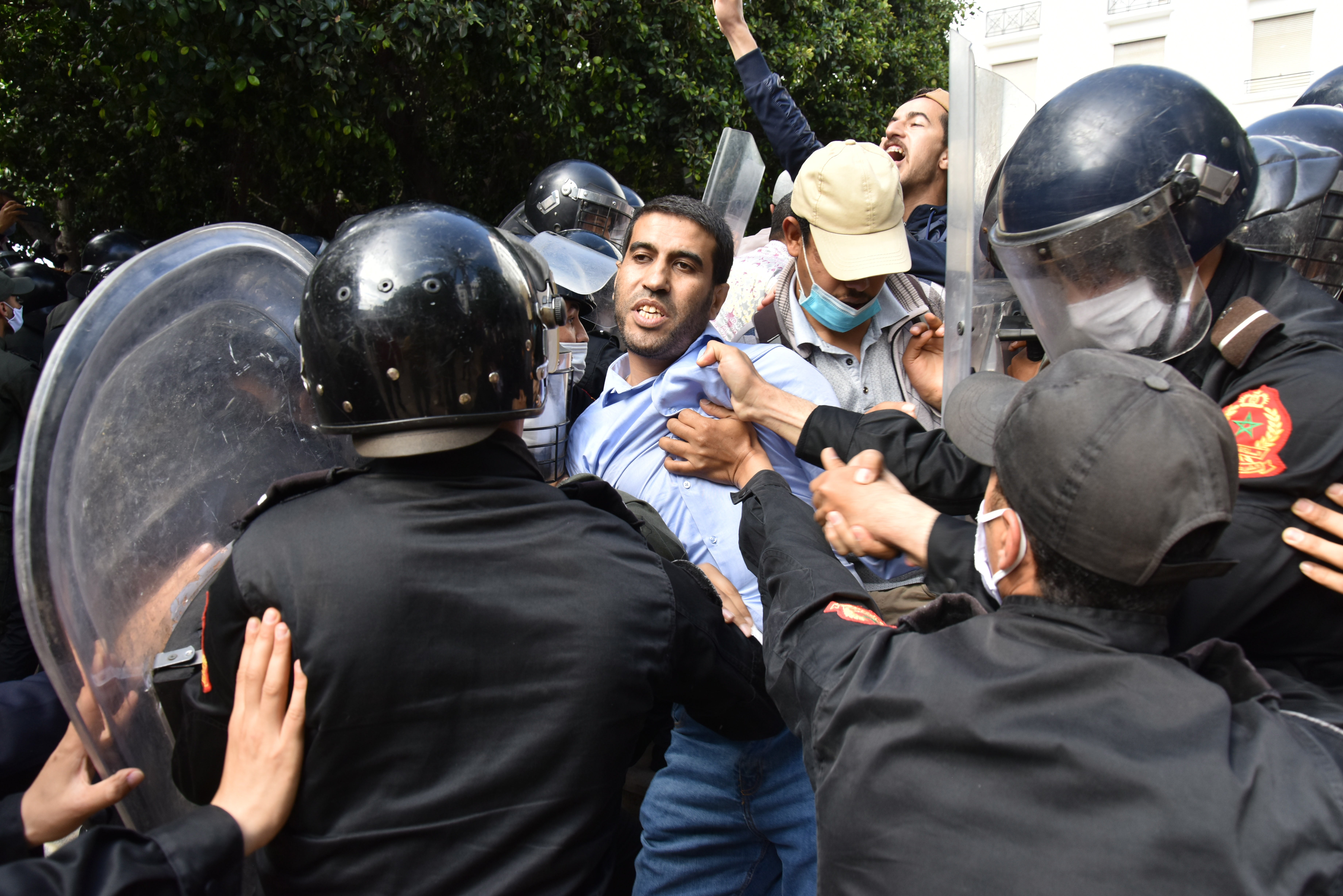 Moroccan security forces disperse a protest in solidarity with Palestinians organized in front of the Parliament building in Rabat, Morocco, 10 May