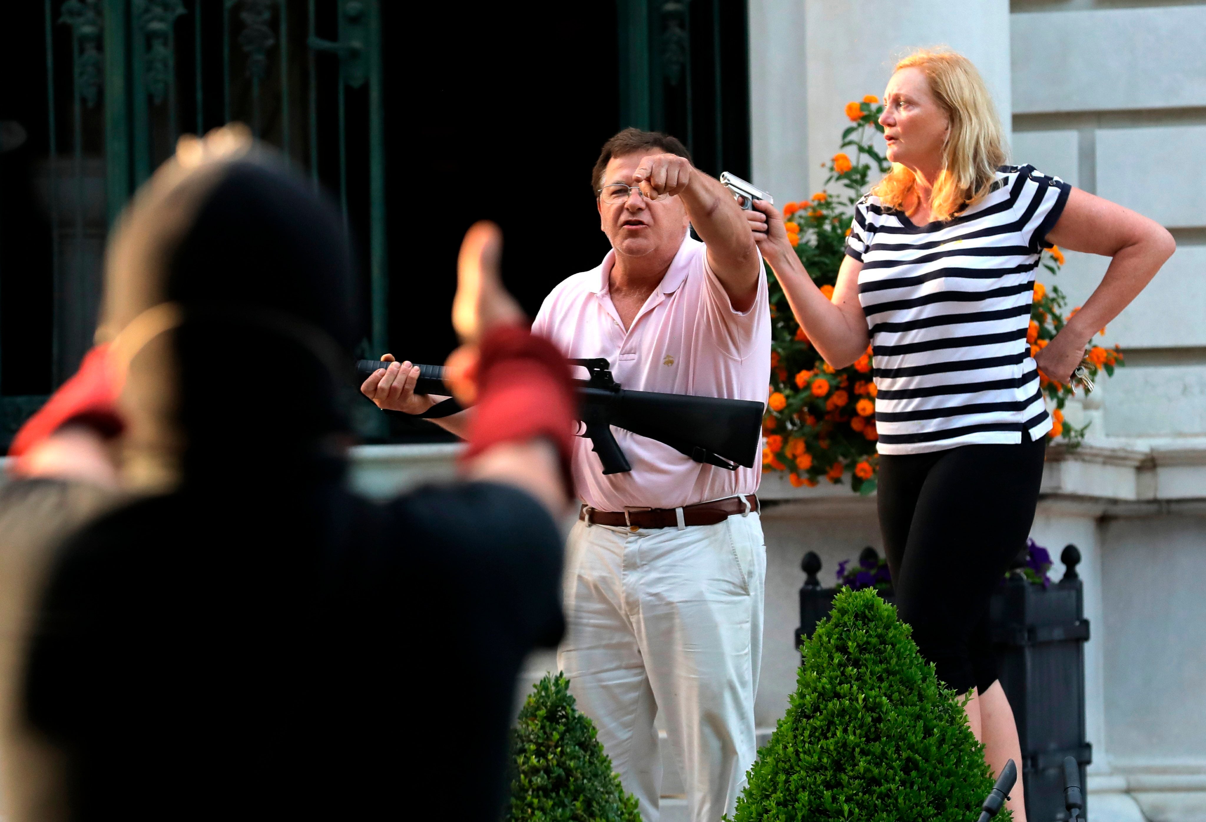 Armed homeowners Mark and Patricia McCloskey confront Black Lives Matter protesters in St Louise on 28 June, 2020