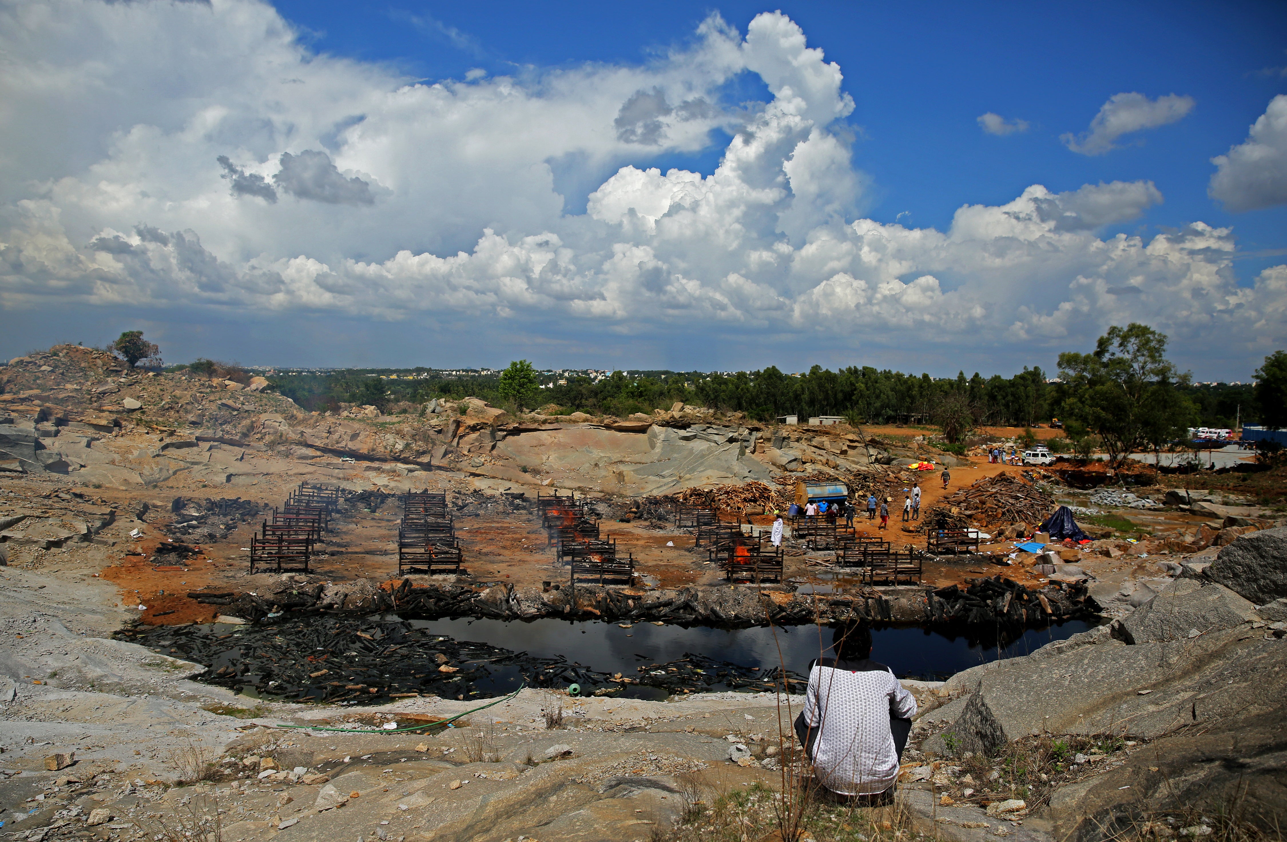 Funeral pyres for COVID-19 victims burn during a mass cremation