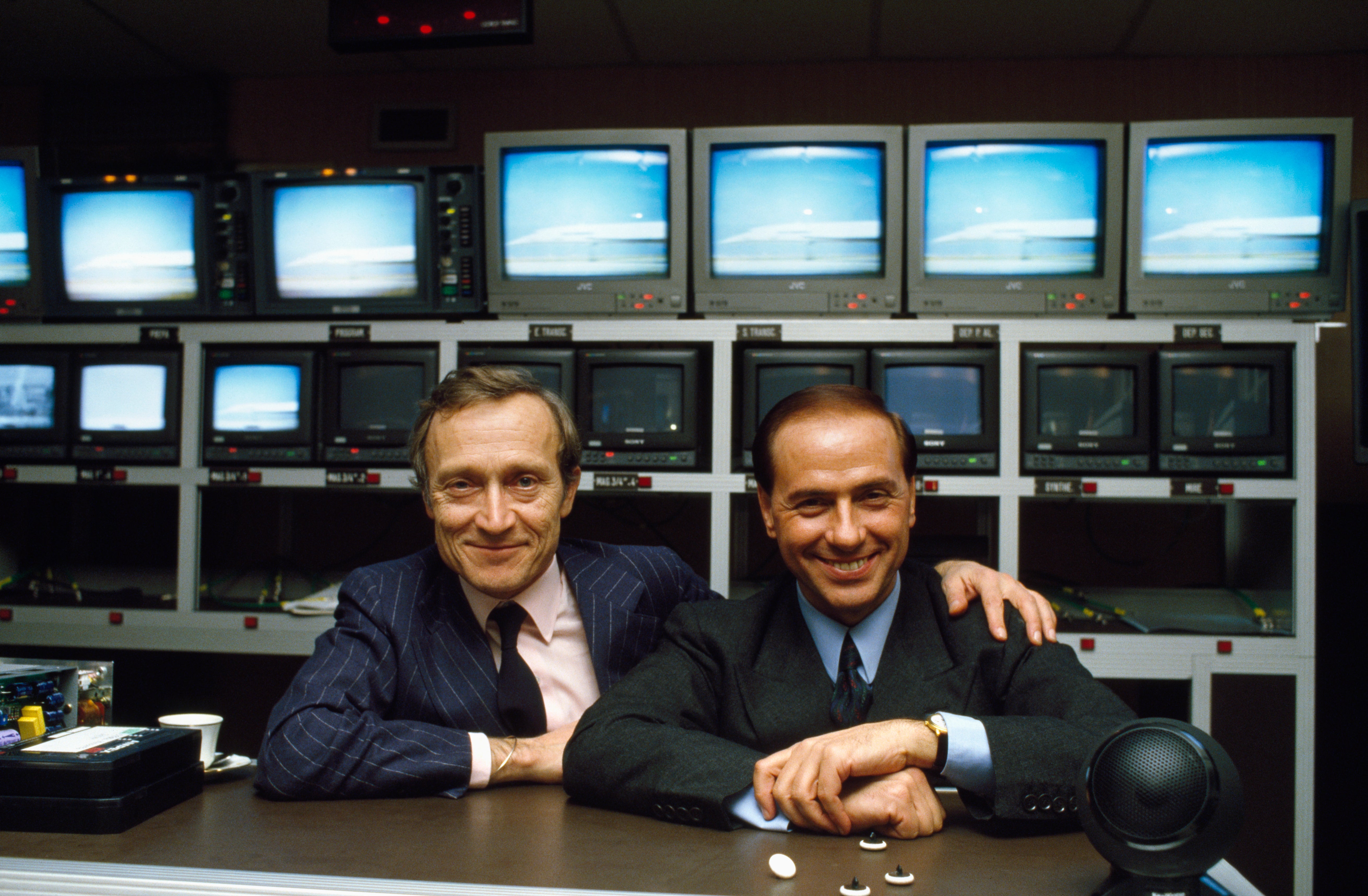 Berlusconi, pictured with French television executive Jerome Seydoux, was a media mogul