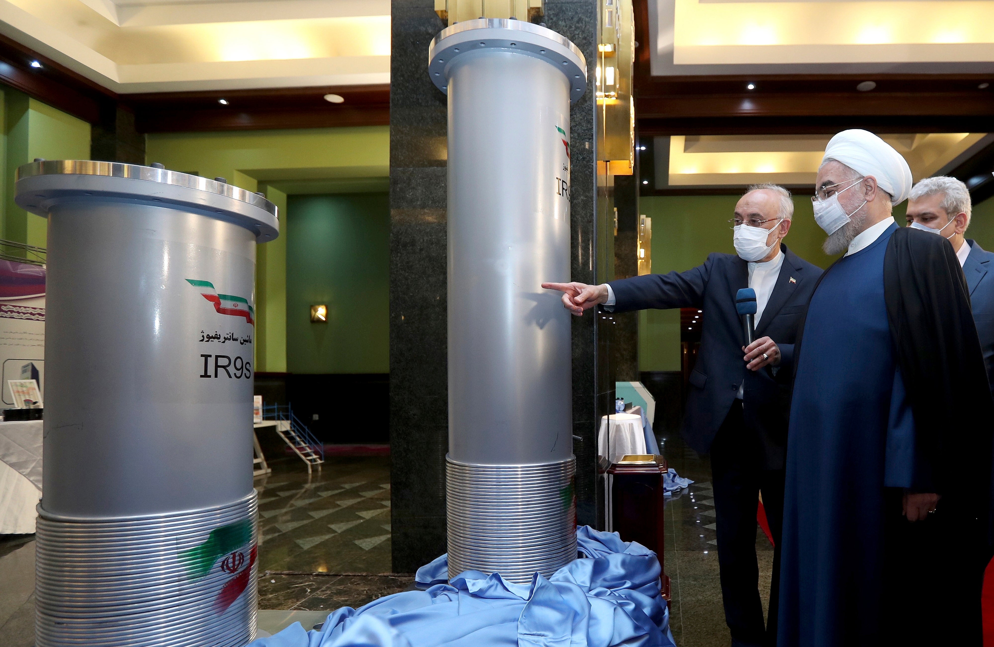 Iranian president Hassan Rouhani (second right) visits an exhibition of Iran's nuclear achievements in Tehran