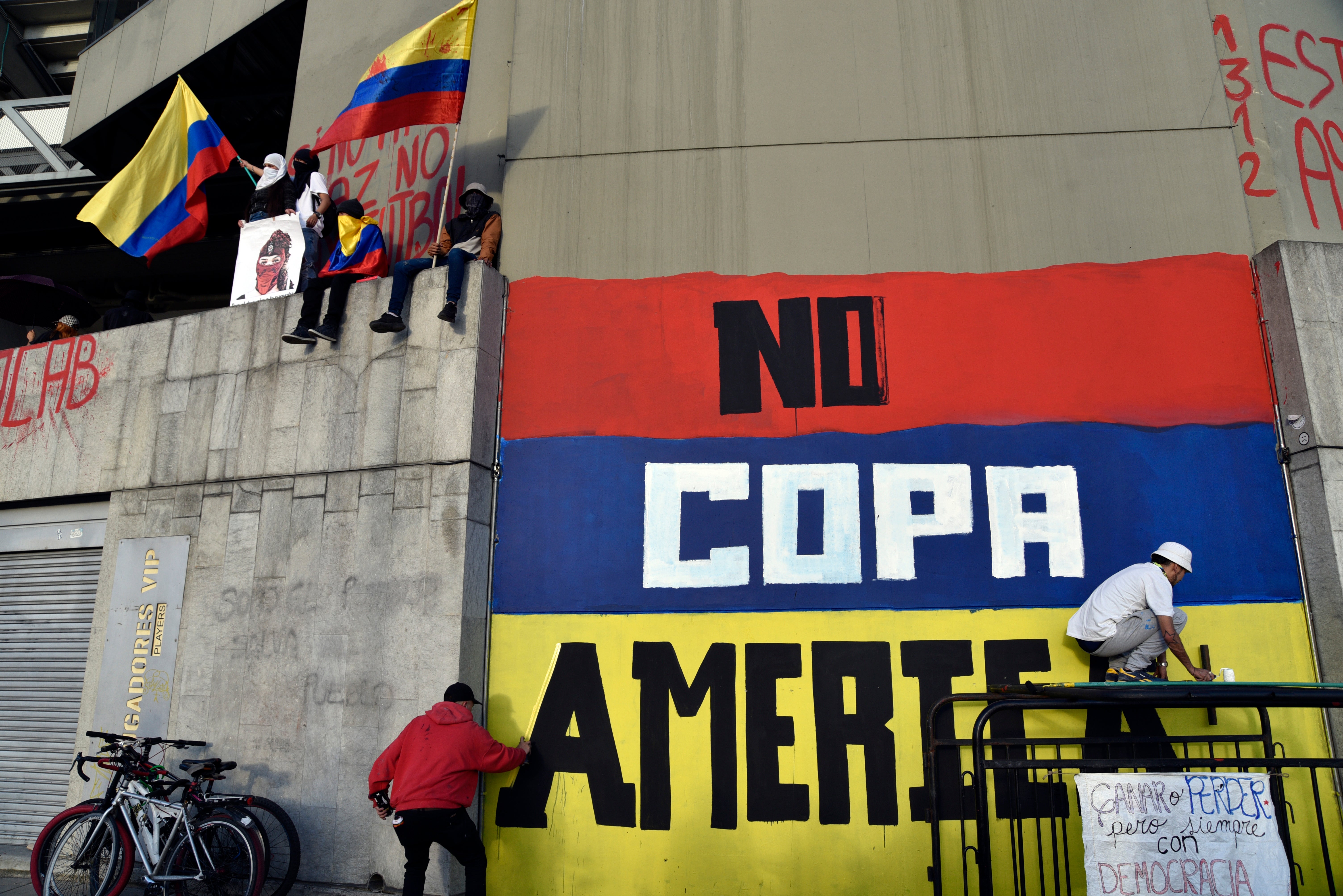 A protester in Colombia calls for the tournament to be moved from the country