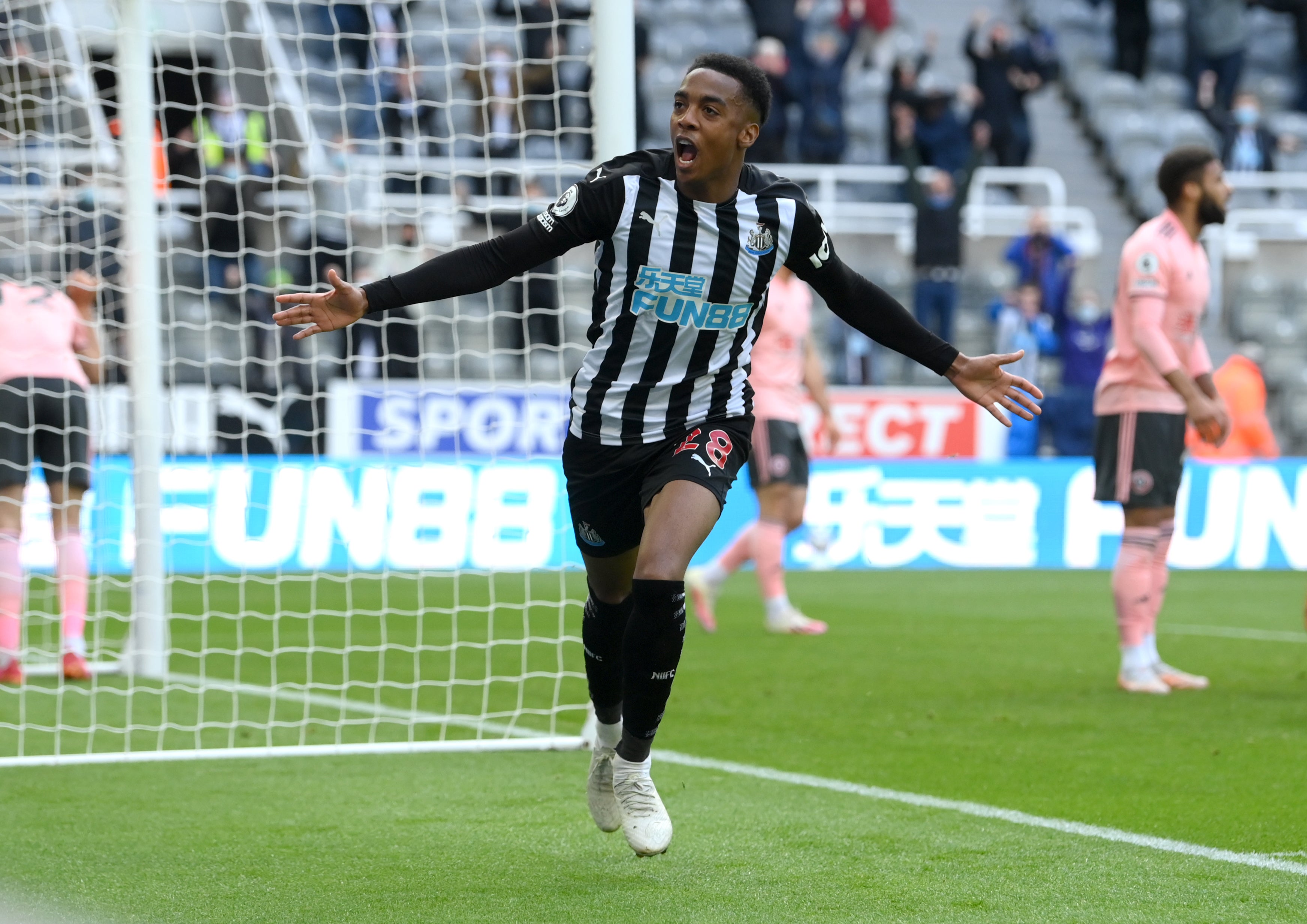 Joe Willock celebrates scoring for a sixth straight game