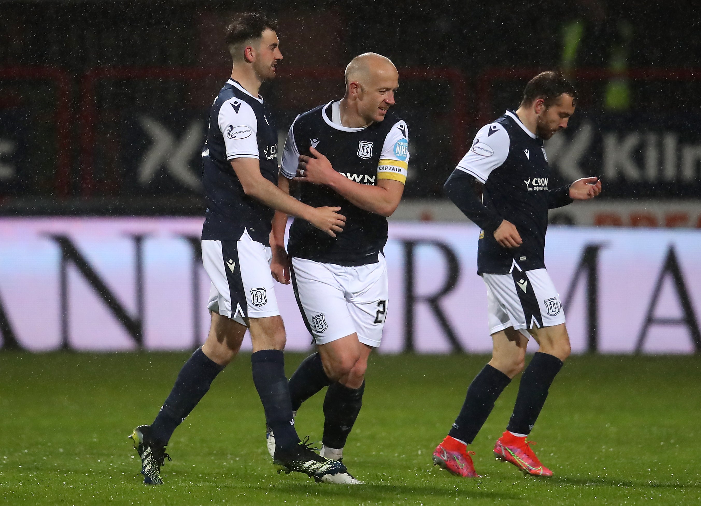 Dundee’s Charlie Adam (centre) celebrates scoring his side’s second goal of the game