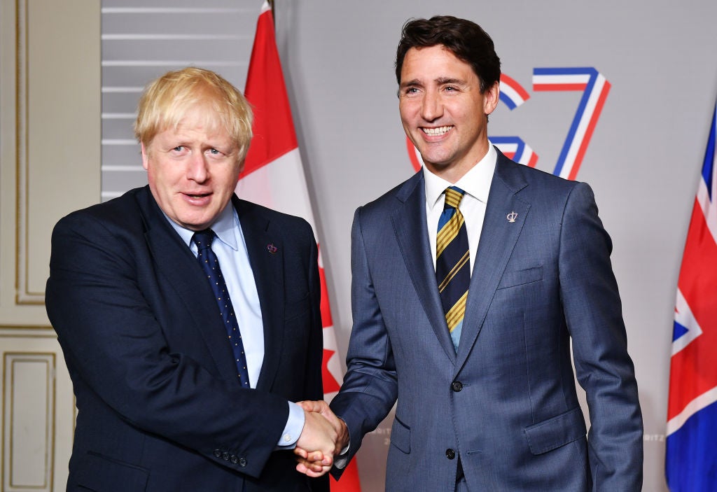 Boris Johnson shakes hands with Justin Trudeau. The UK government intends to upgrade its trade deal with Canada