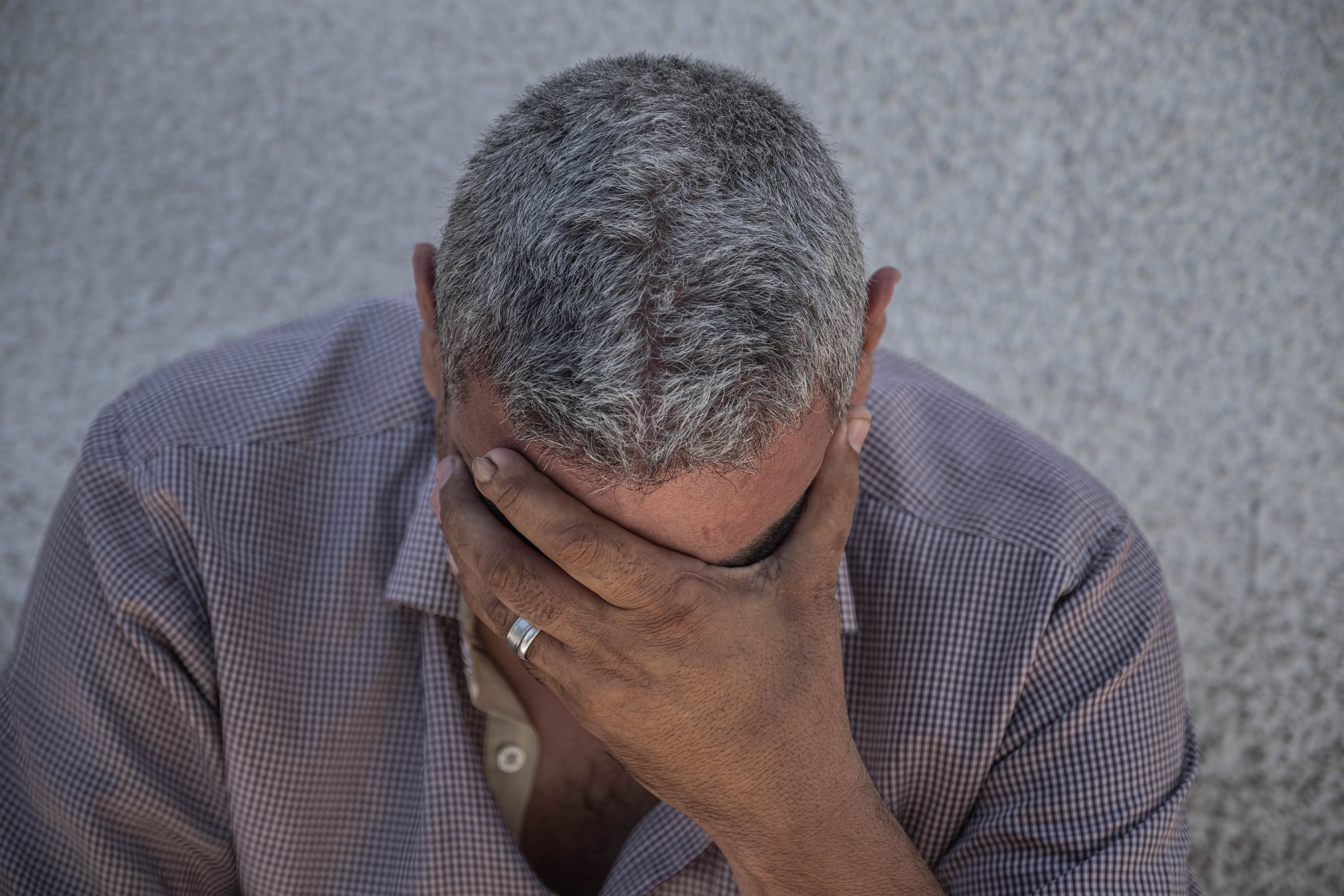 A relative of Palestinian Hassan Salem, who was killed during an Israeli raid on west Gaza City, mourn during his funeral on May 19, 2021