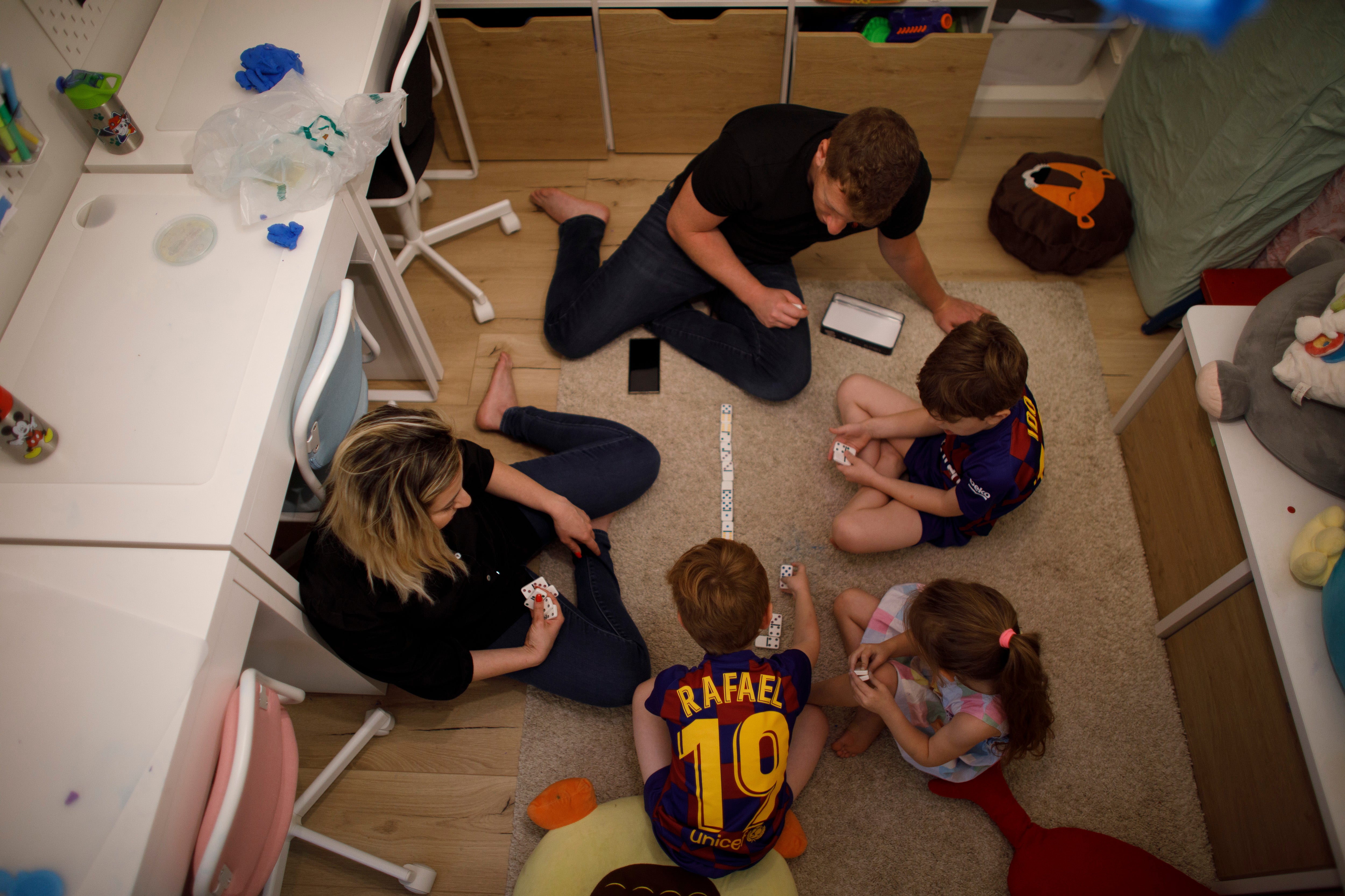 Stella Weinstein, left, with her family in the shelter in their apartment in Ashdod, Israel