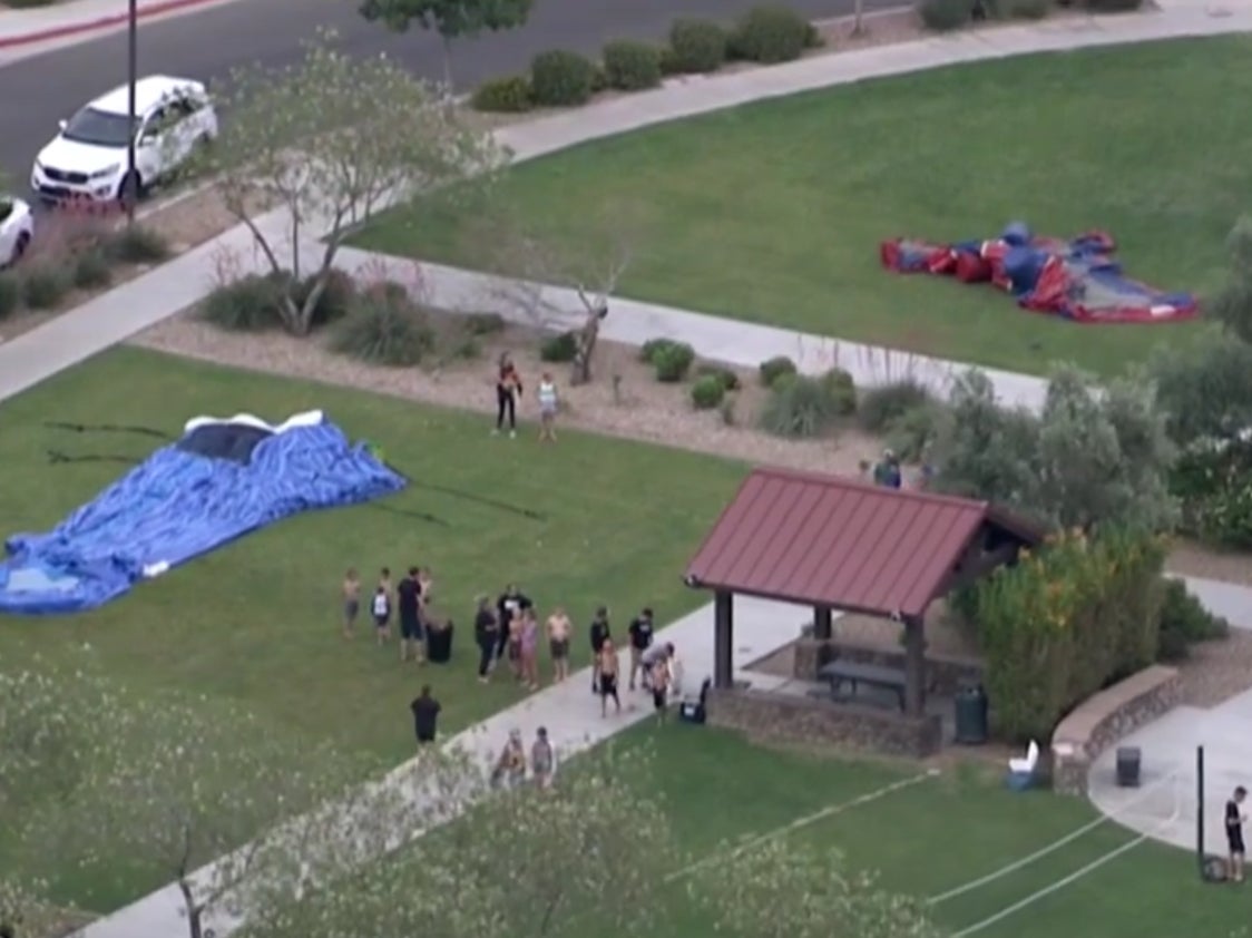 Footage from a bouncy castle being blown into the air, injuring four children, on Thursday