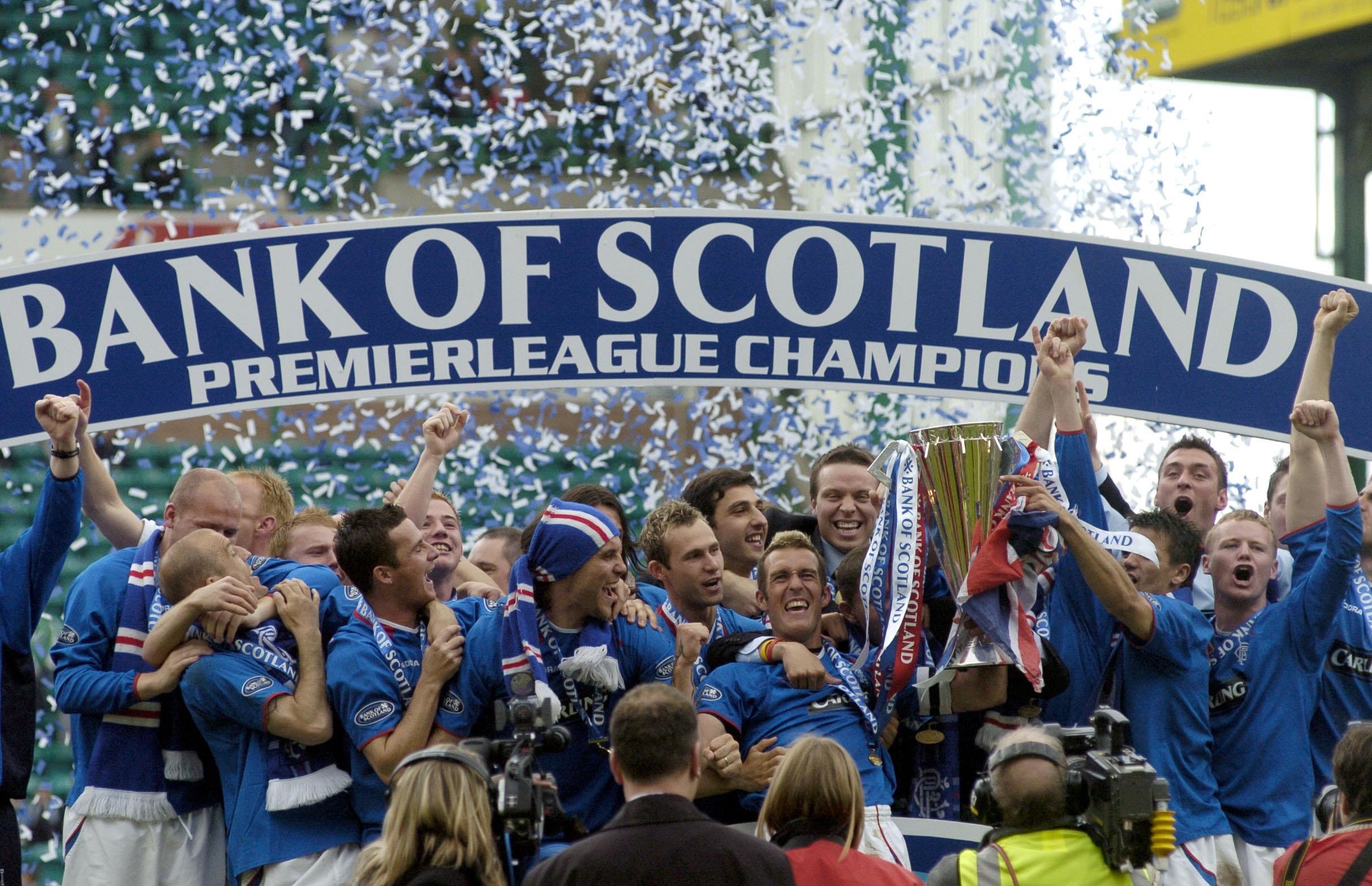 Rangers’ players celebrate with the SPL Trophy after defeating Hibernian 1-0