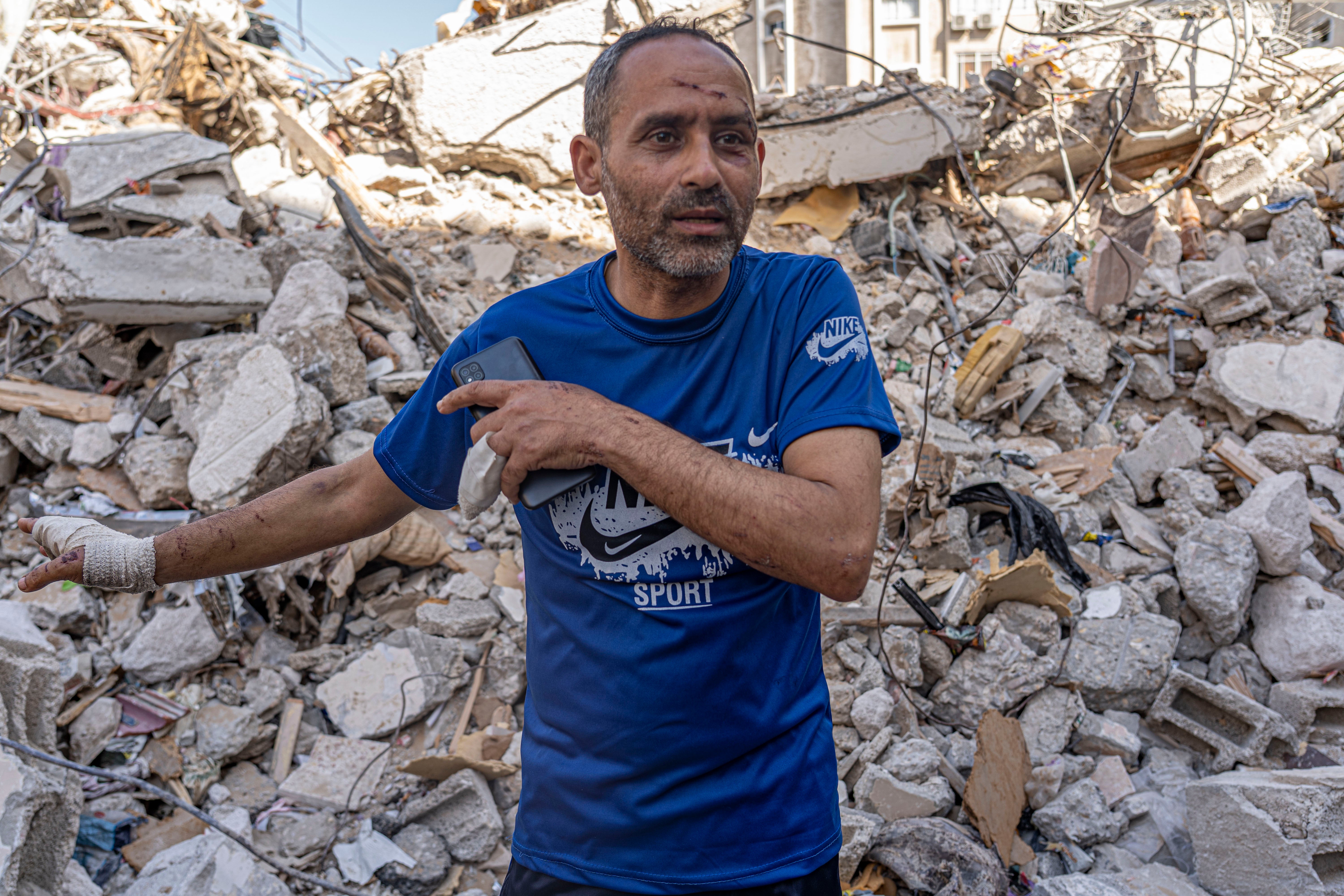 Riad Shkuntina, 42, who lived a floor above Dr Abu Al-Ouf, lost his wife and four of his children in the strike