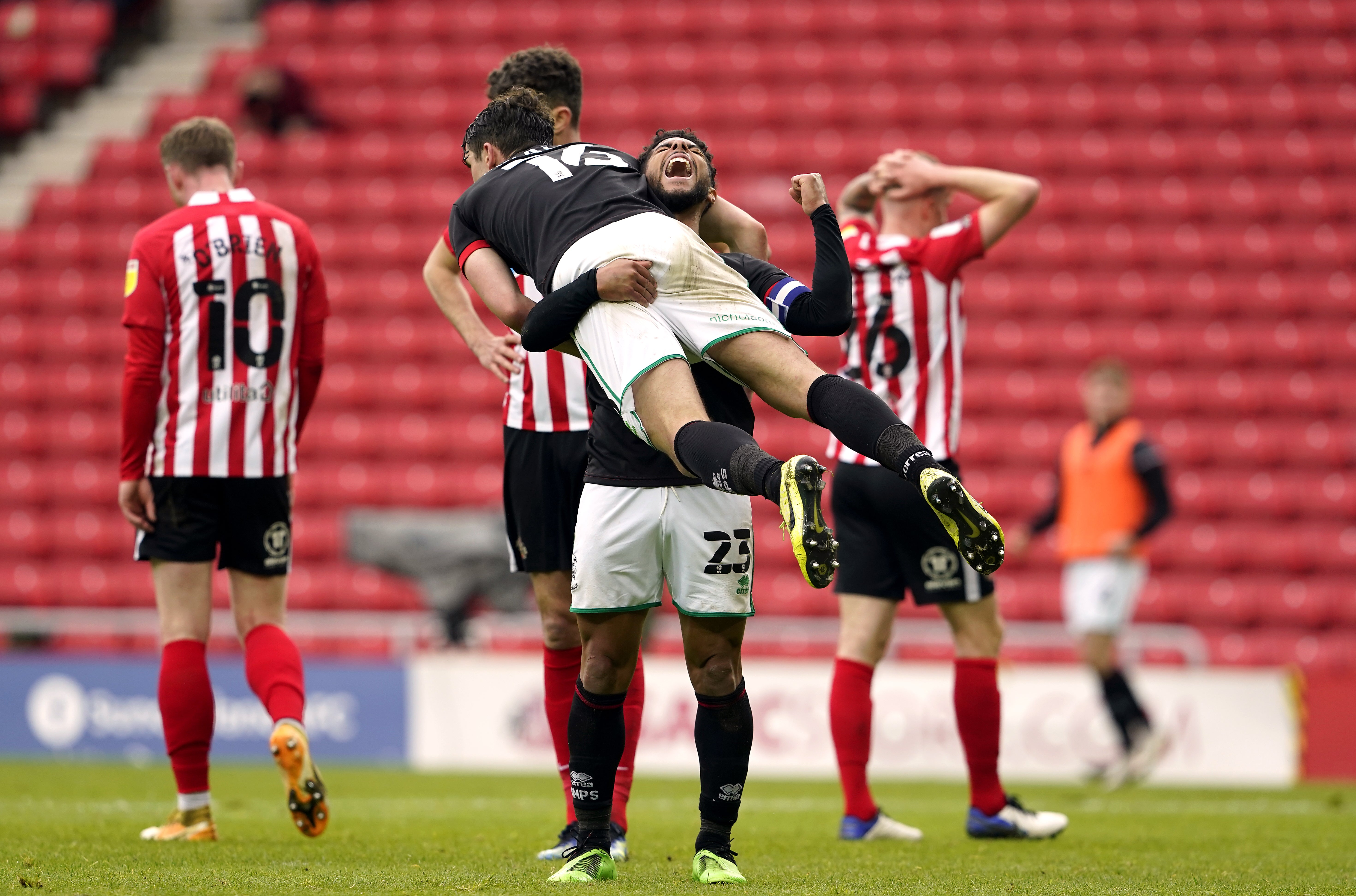 Lincoln celebrate their 3-2 aggregate victory over Sunderland