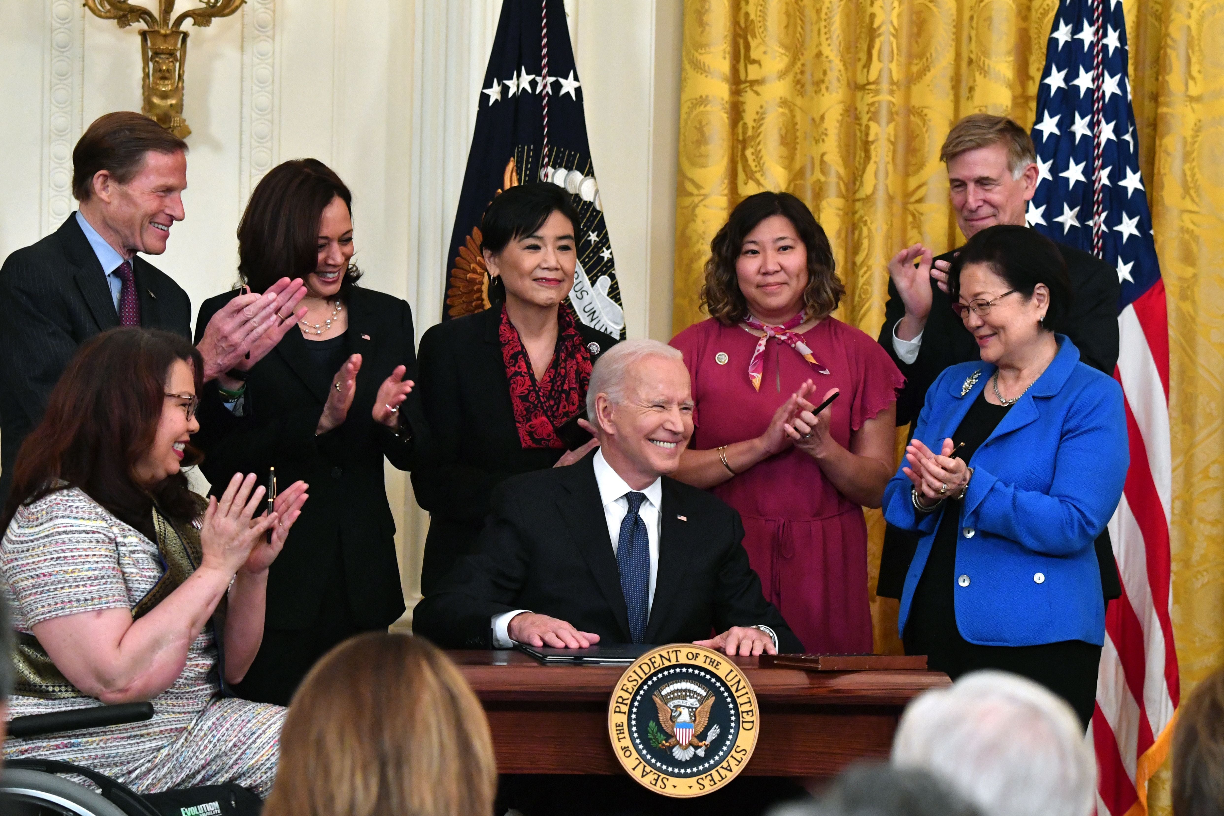 US President Joe Biden smiles after signing into law the Covid-19 Hate Crimes Act, in the East Room of the White House in Washington, DC on May 20, 2021.