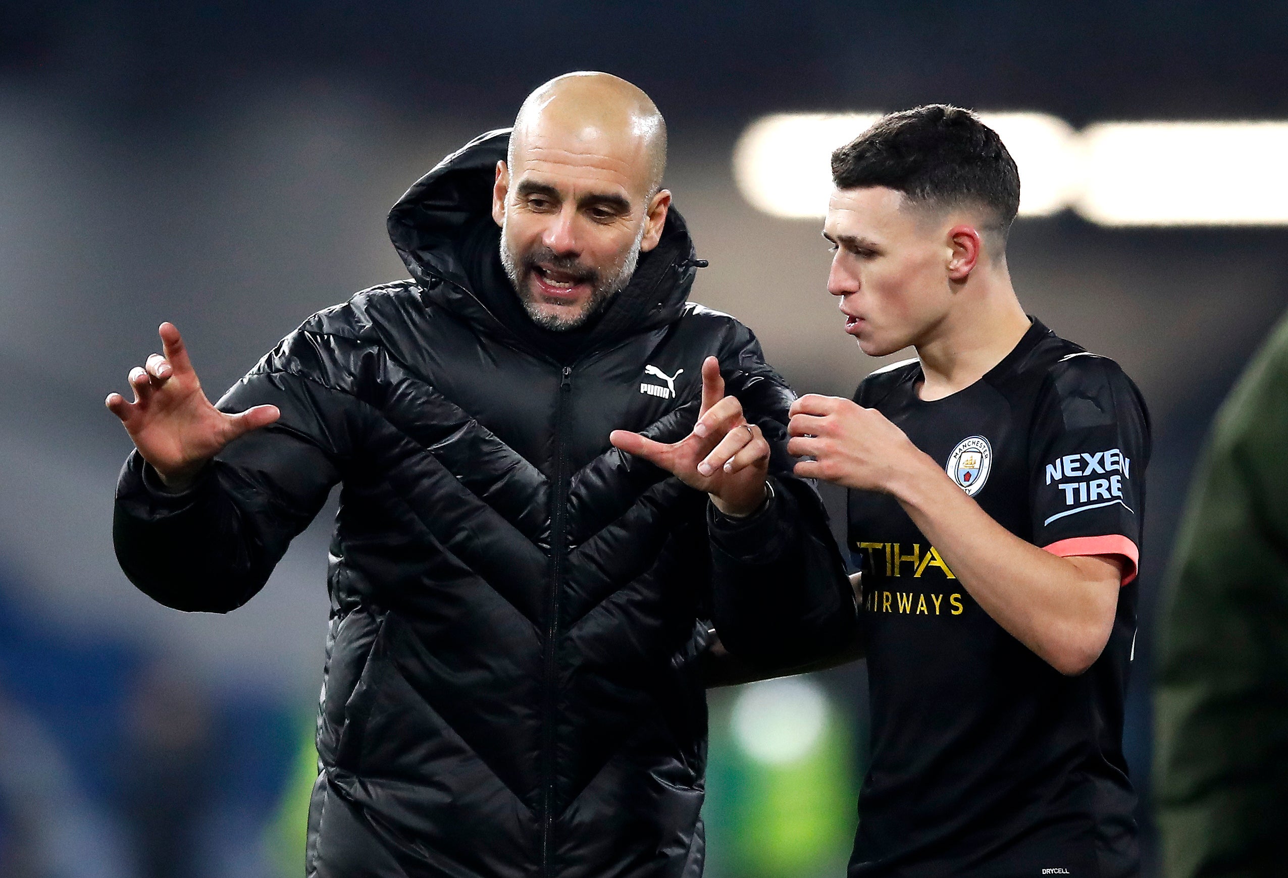 Phil Foden (right) is thriving under Pep Guardiola (left)