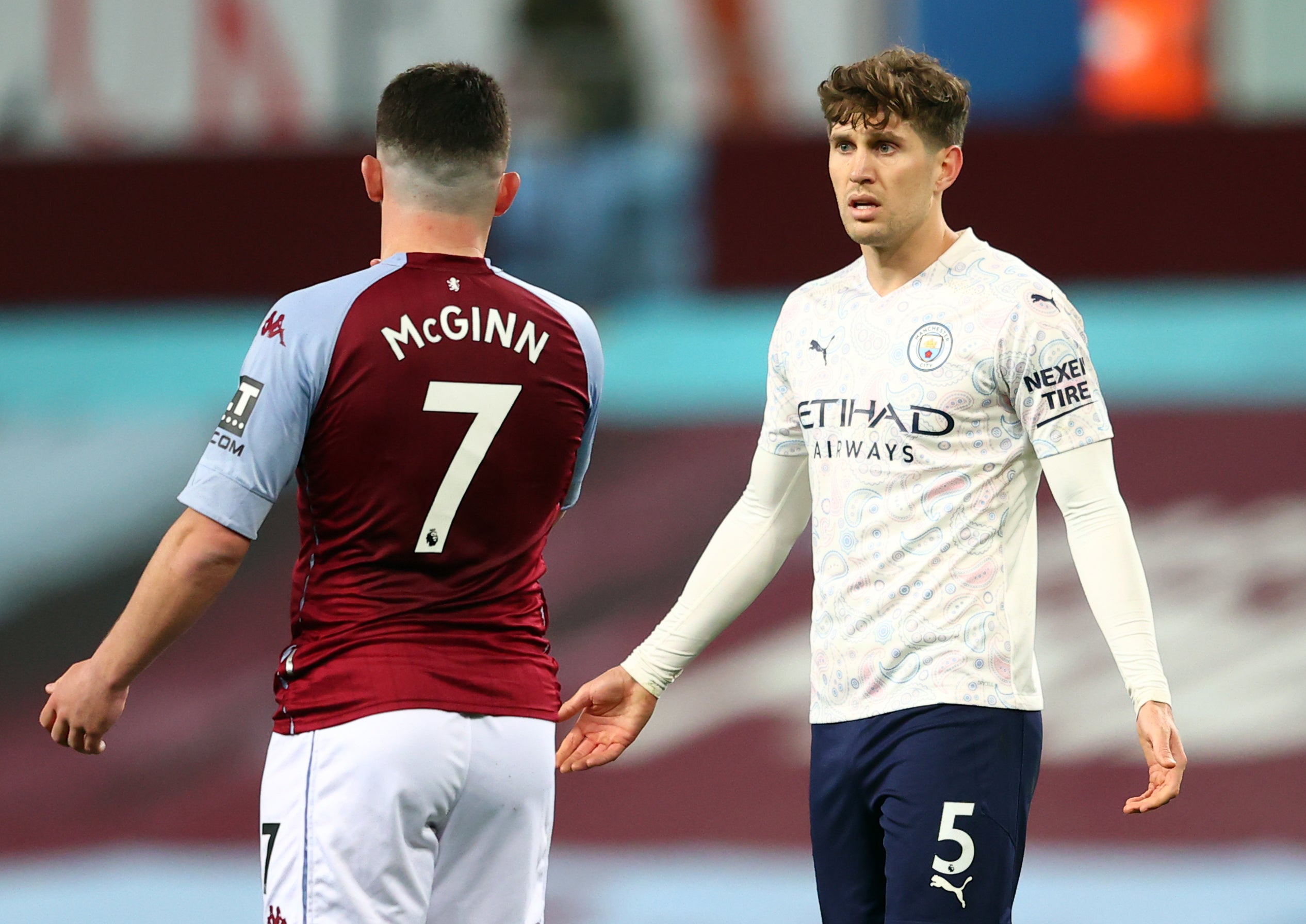 Ben White has been likened to Manchester City defender John Stones, right