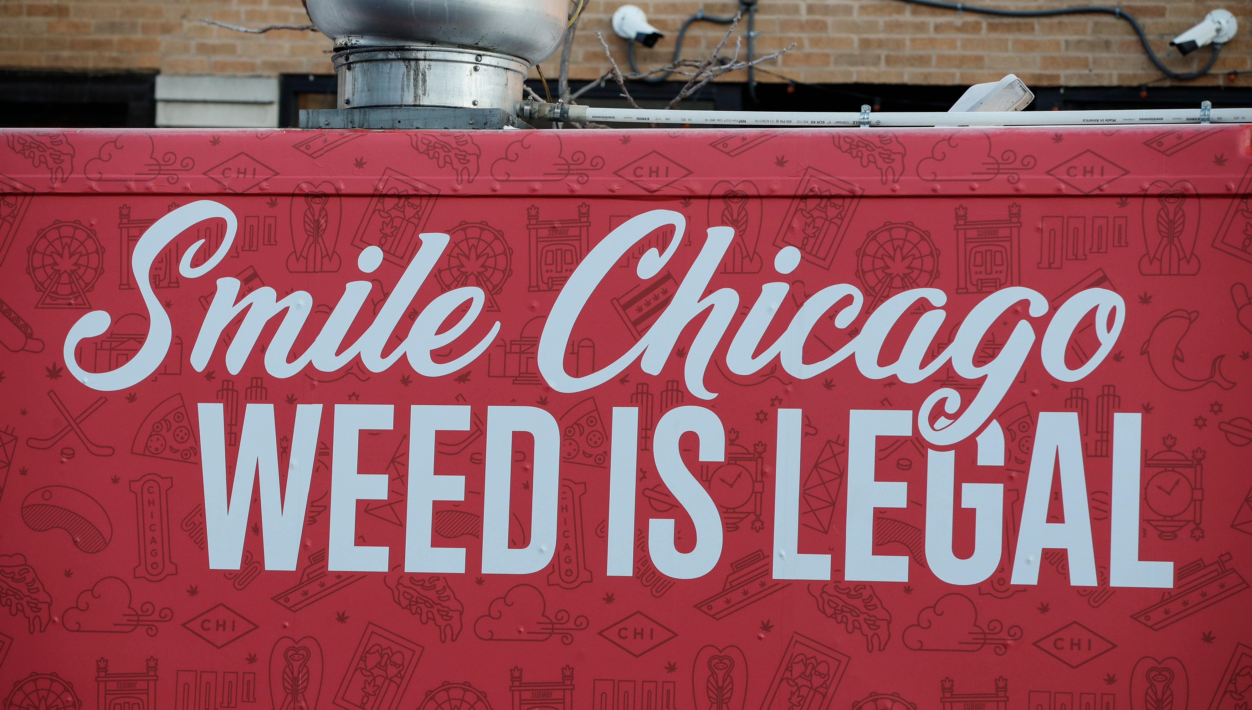 A food truck sits outside the Sunnyside Cannabis Dispensary as customers wait in line to buy marijuana, on January 1, 2020 in Chicago, Illinois. - On the first day of 2020, recreational marijuana became legal in Illinois, which joins 10 other US states with legal use of recreational marijuana.