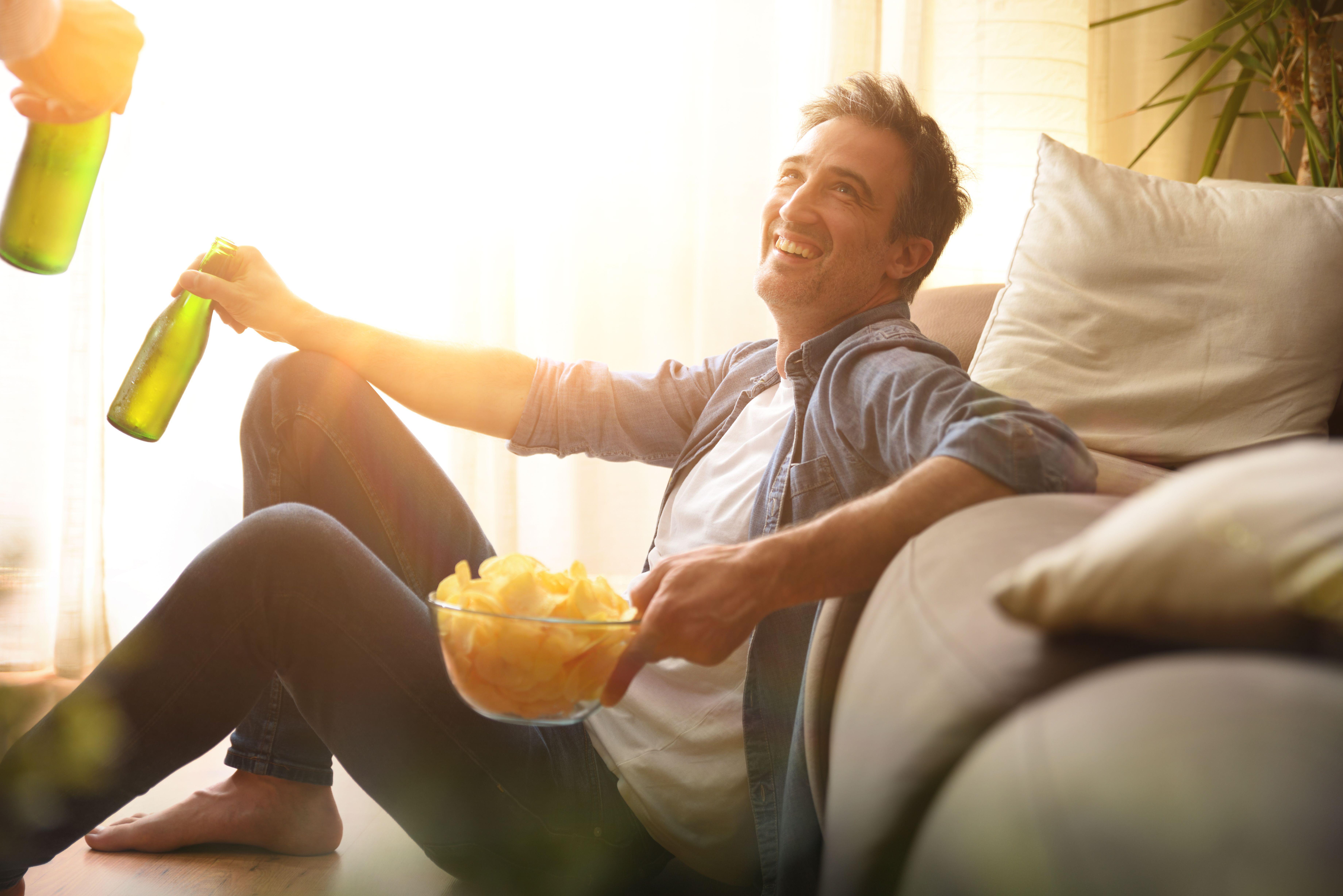 Happy man with snacks