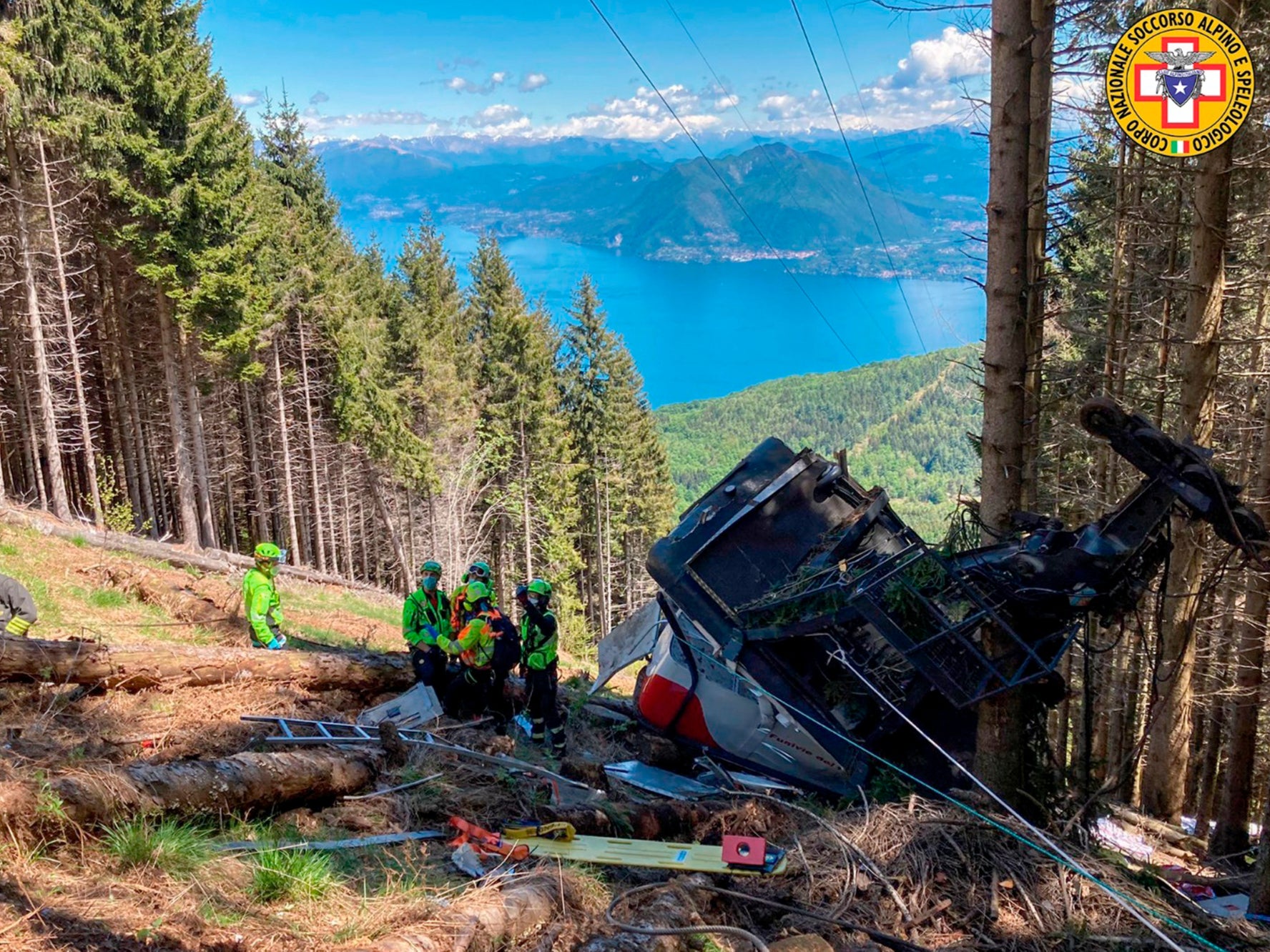 Rescuers by the wreckage of the cable car