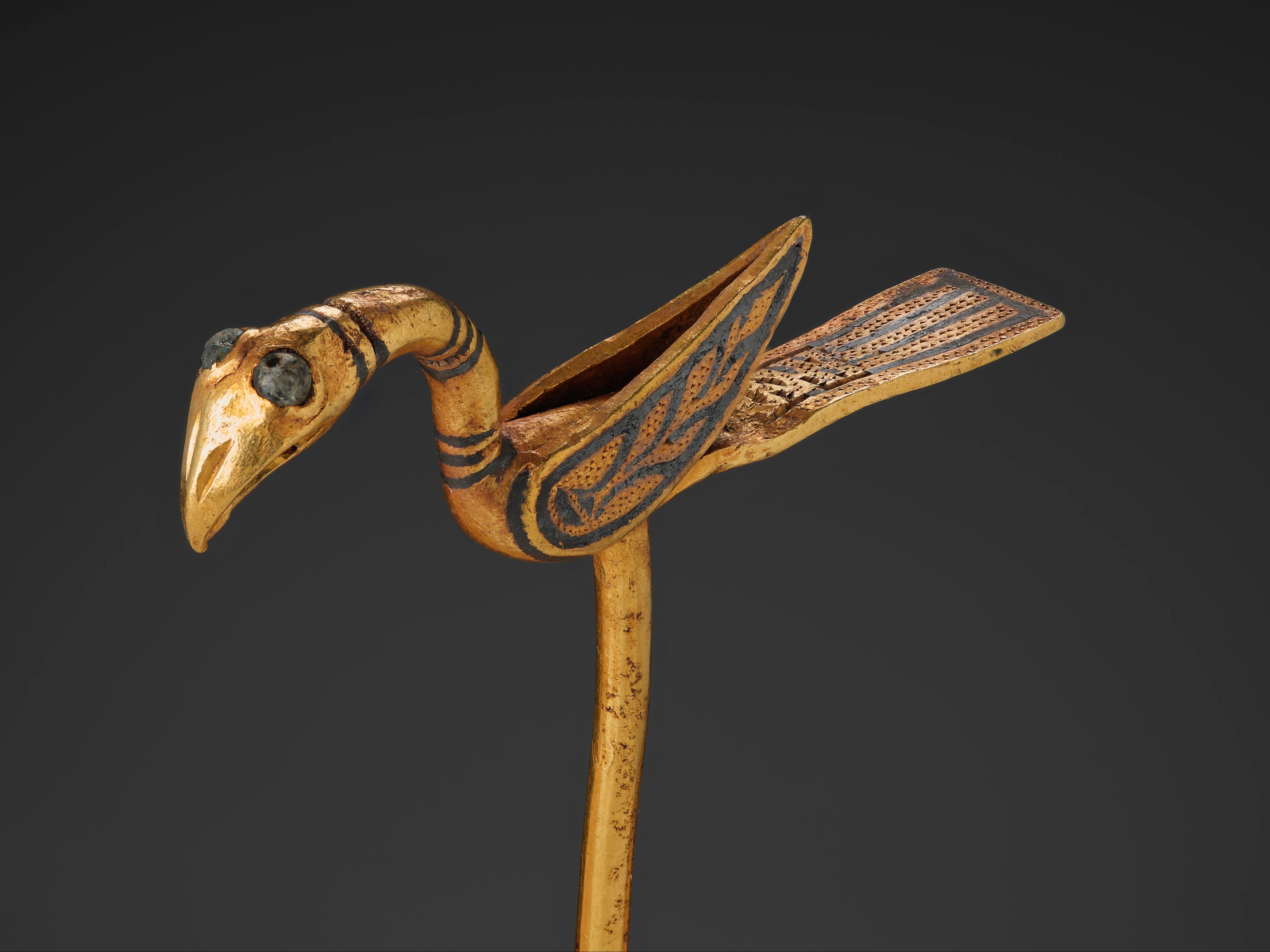 This piece, made of gold and in the shape of a bird, is believed to be a cloak pin