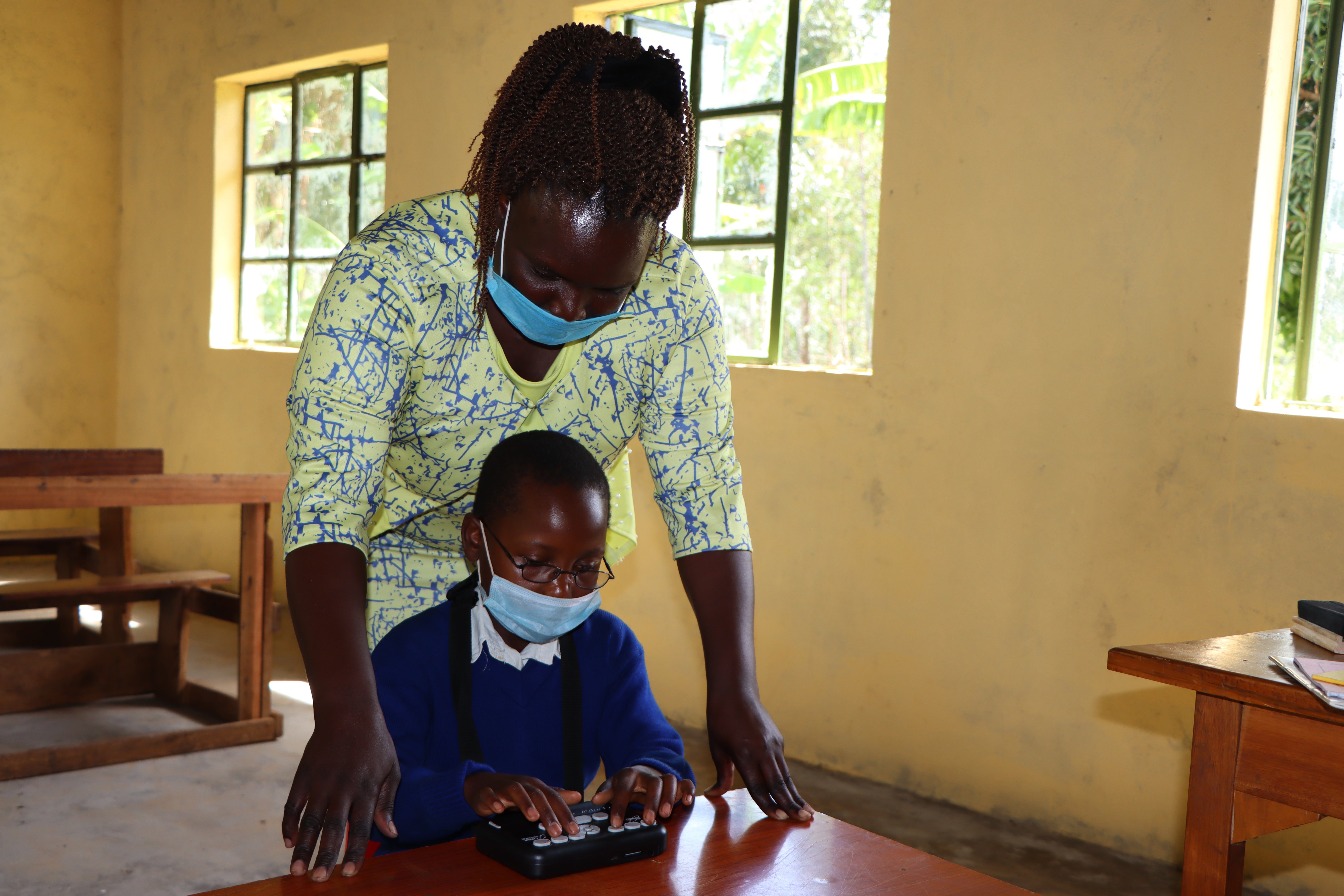 A student from the Leonard Cheshire’s Girls’ Education Challenge Transition project in Kenya uses an Orbit Reader, a portable device that helps people with visual impairments read and take notes