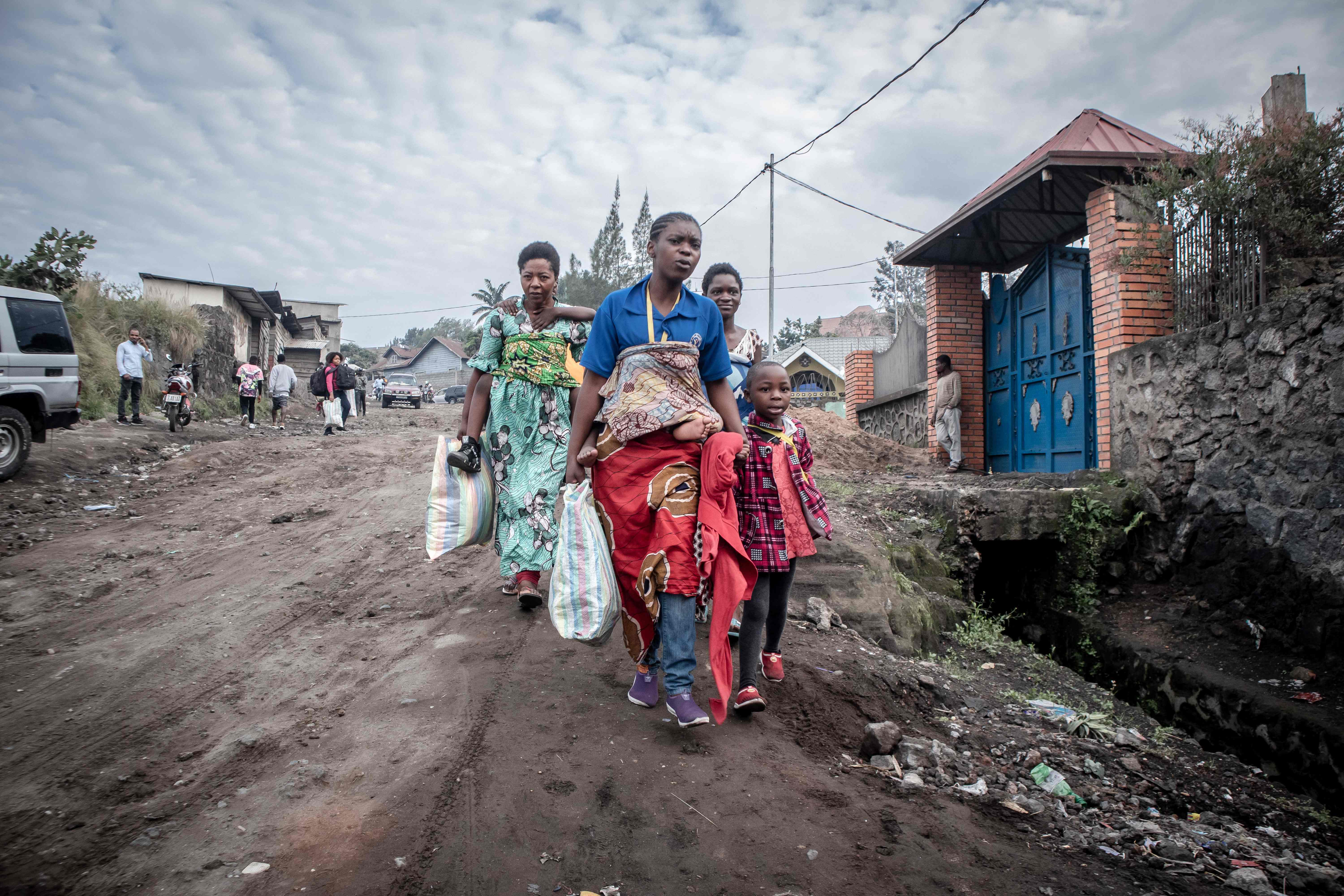 Residents of Goma in Congo hurry after an evacuation order was given on Thursday