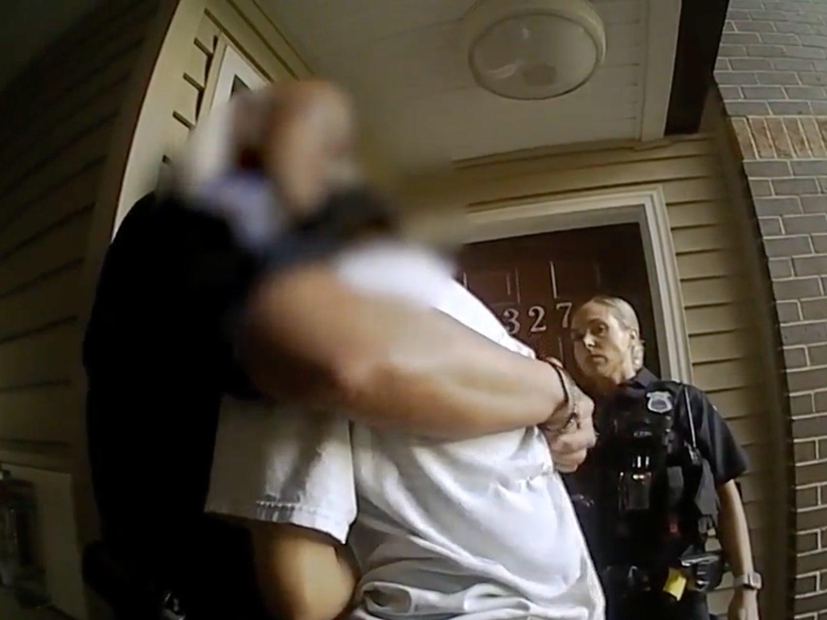 Body camera footage captured an officer hugging an armed woman in a mental health crisis.