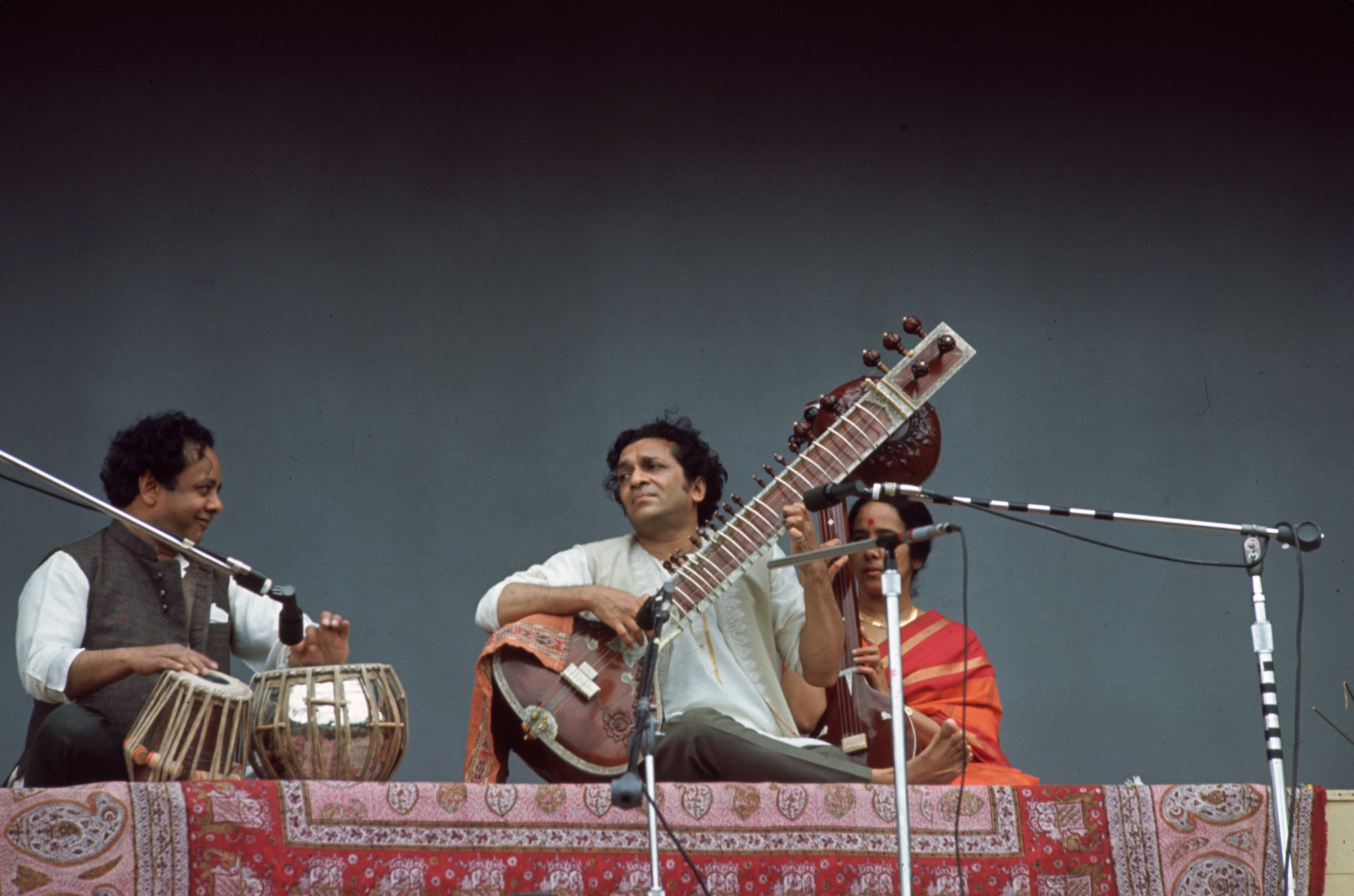 Indian musician Ravi Shankar playing a sitar onstage in June 1967