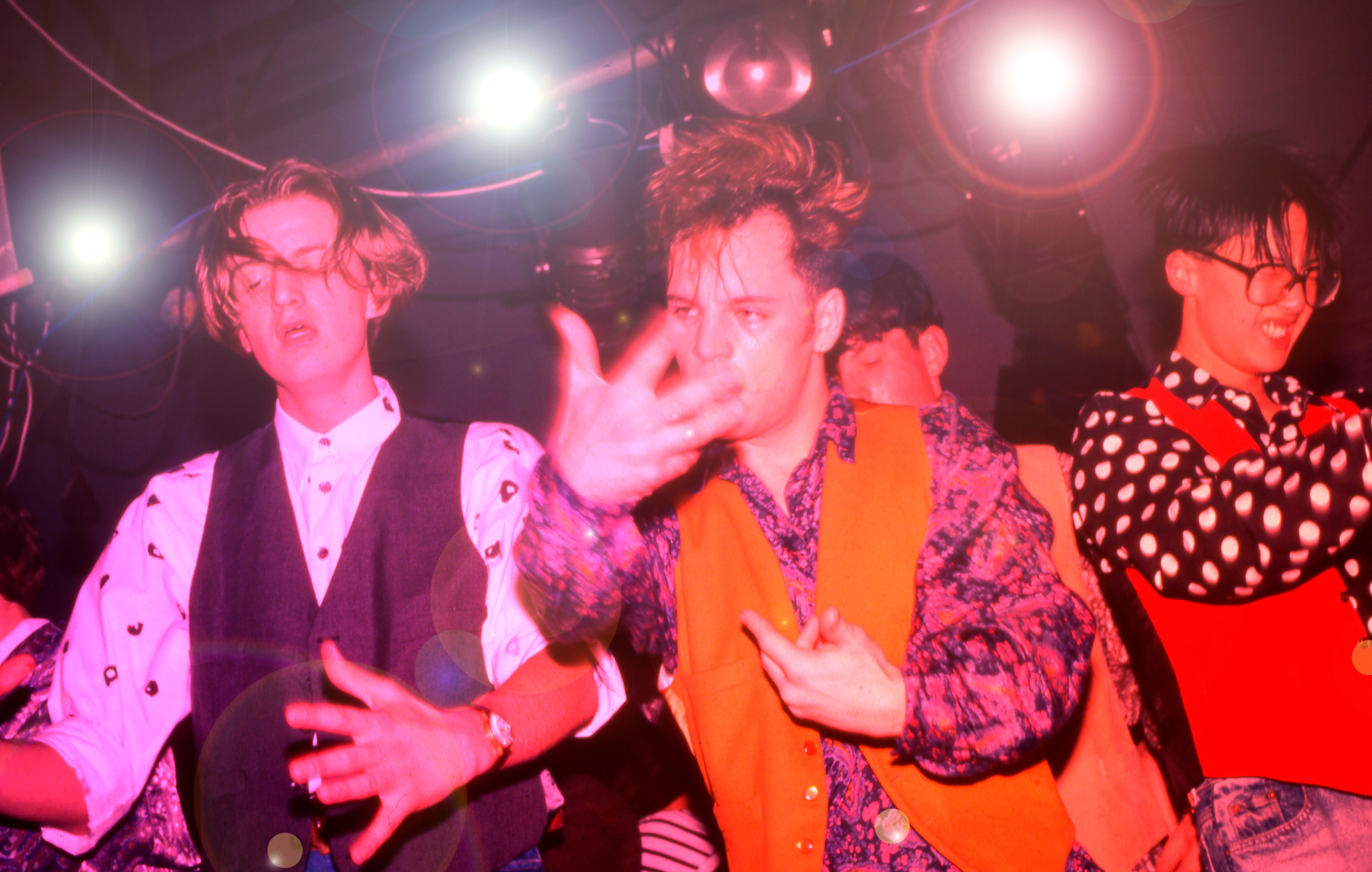 Clubbers on the podiums/main dancefloor at the Haçienda in Manchester 1988