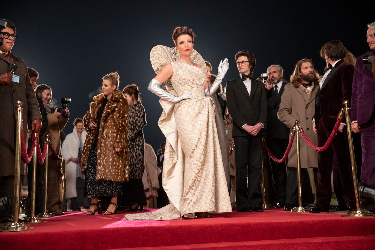 Emma Thompson as the Baroness and Andrew Leung as Jeffrey in ‘Cruella’