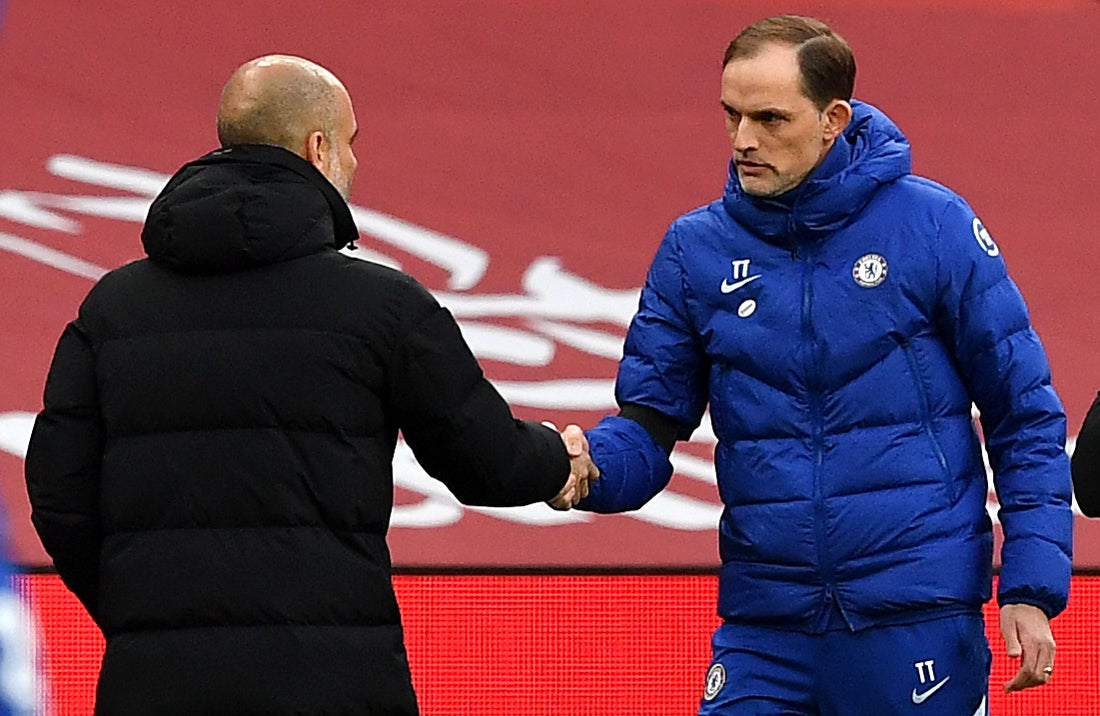 Thomas Tuchel, right, and Pep Guardiola shake hands