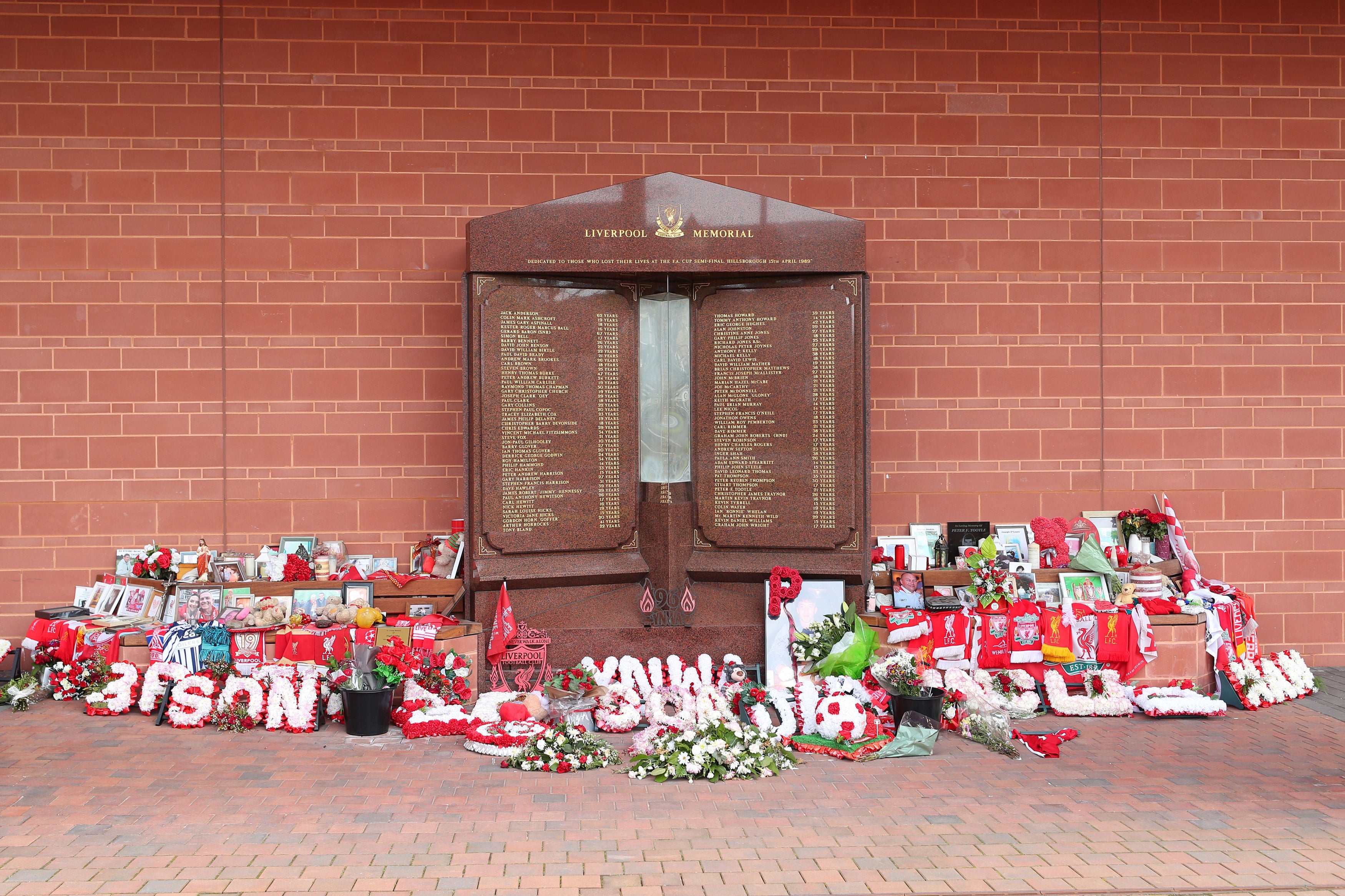 Flowers and tributes left at the Hillsborough Memorial outside Anfield stadium