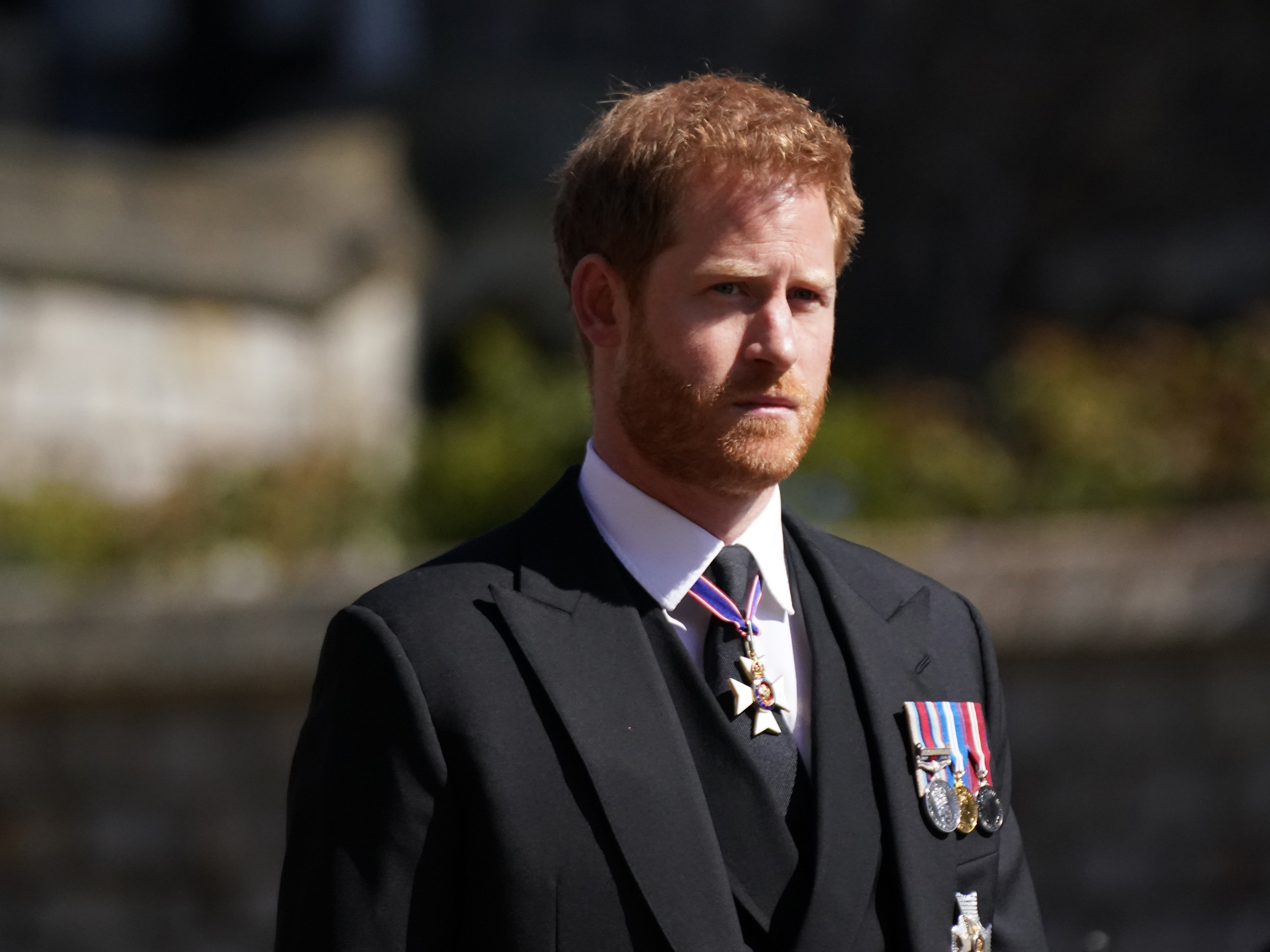 Prince Harry walking in the procession at Windsor Castle, Berkshire, during the funeral of the Duke of Edinburgh